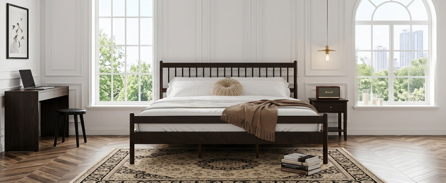 Wide bedroom shot of brown pine king bed between two windows