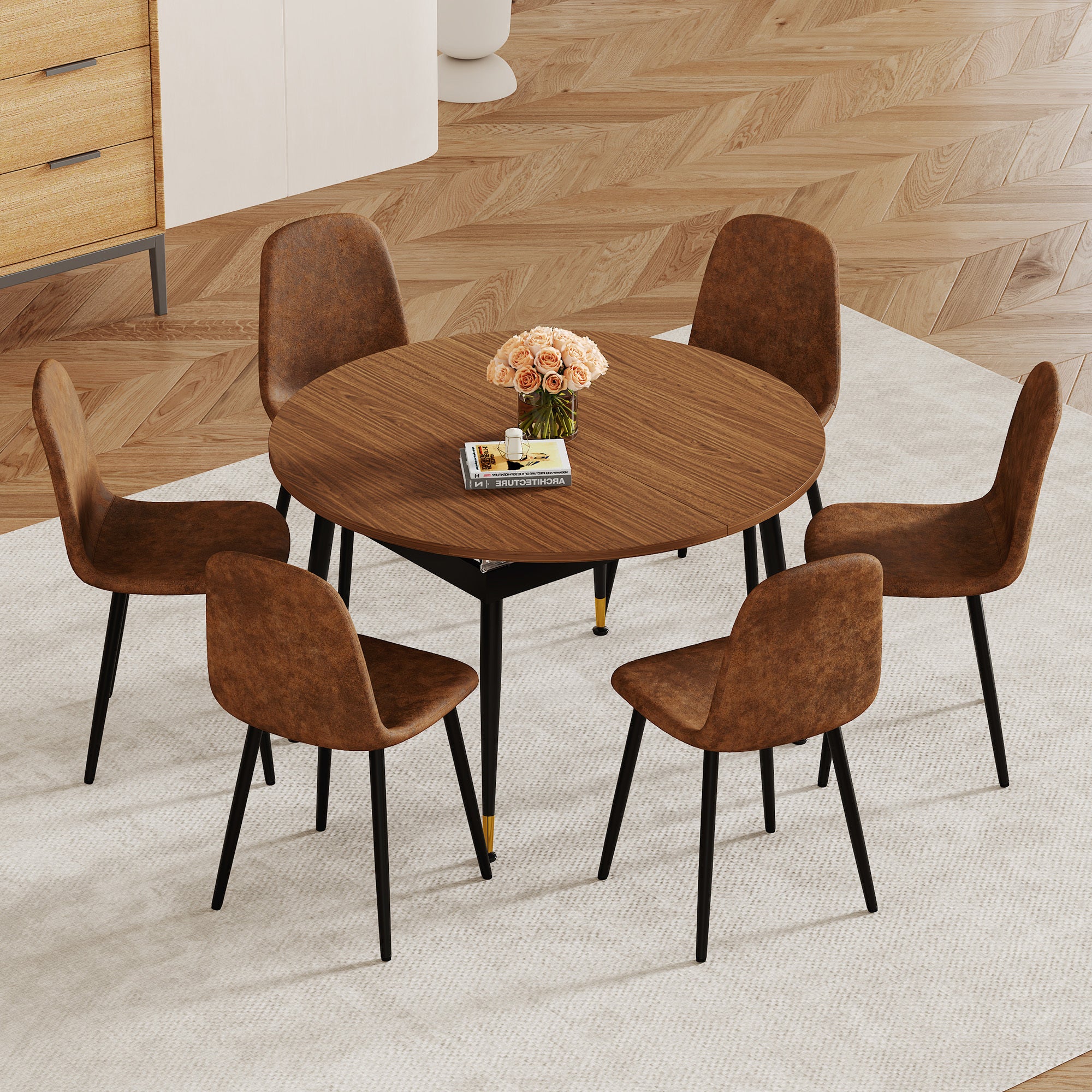 Walnut oval extendable table extended and set with eight brown suede chairs