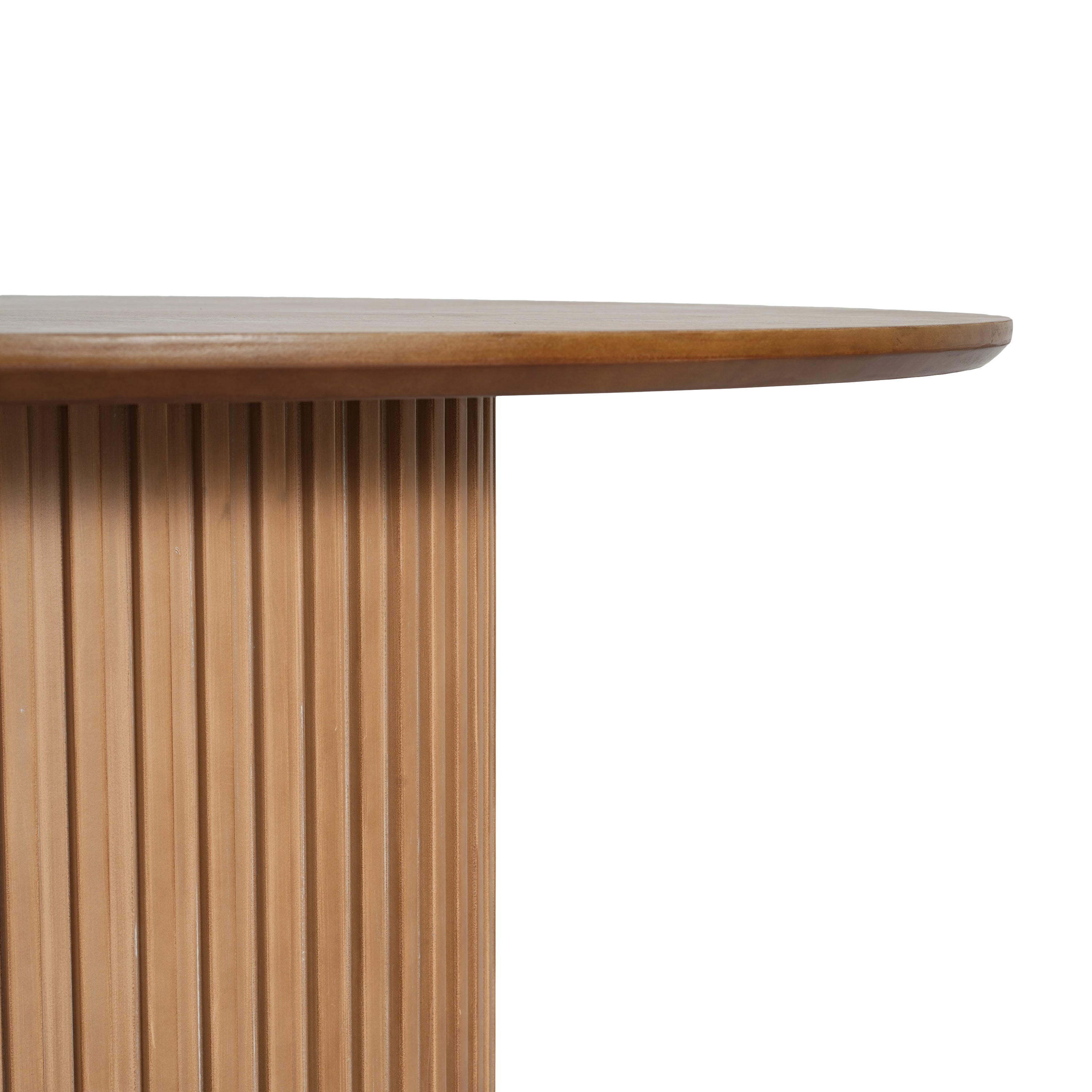 Close-up of the tabletop edge and fluted pedestal base of the oak dining table