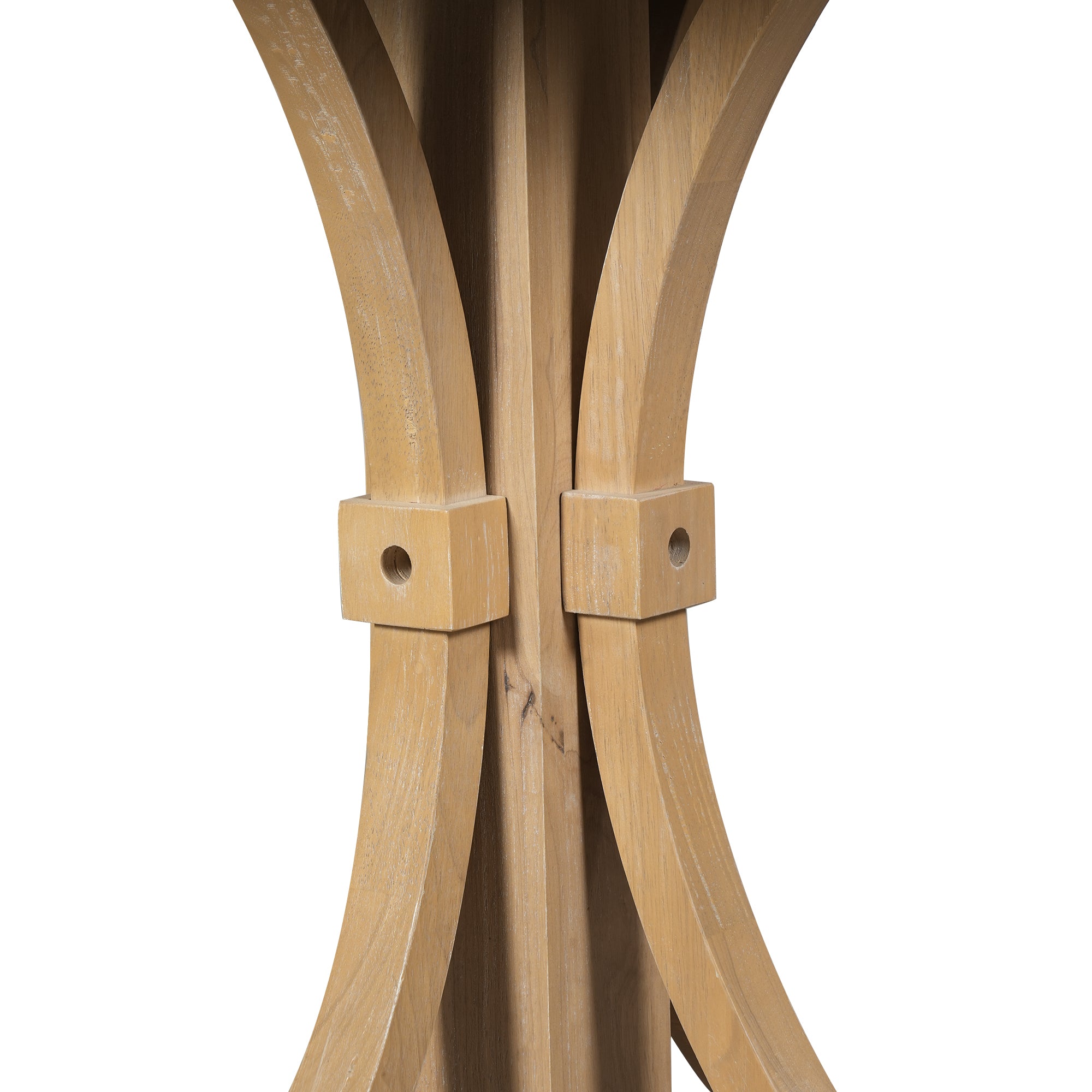 Close-up of the crossed curved trestle uprights joined by square wood block connectors