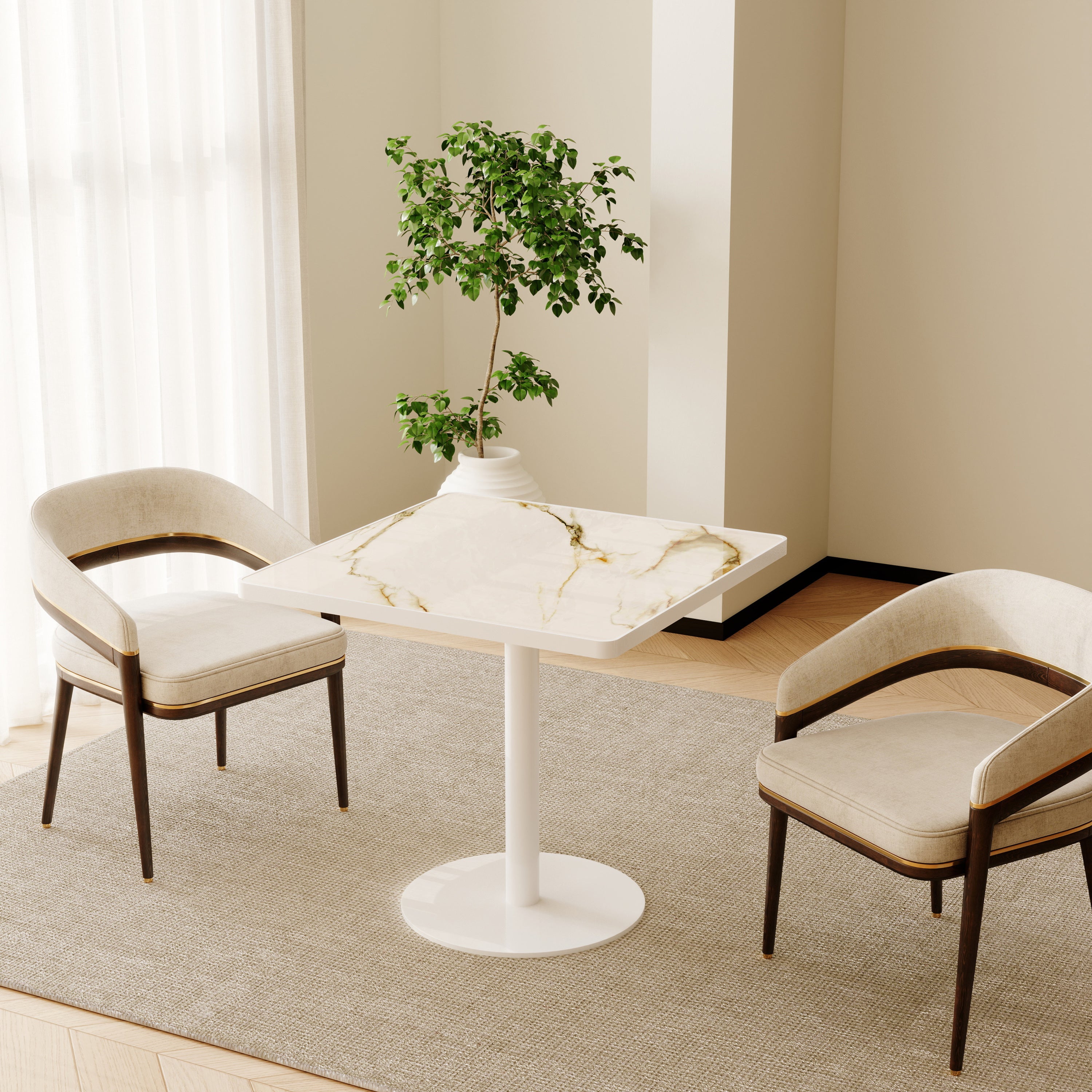 White square dining table in neutral styled room with two cream chairs and potted tree