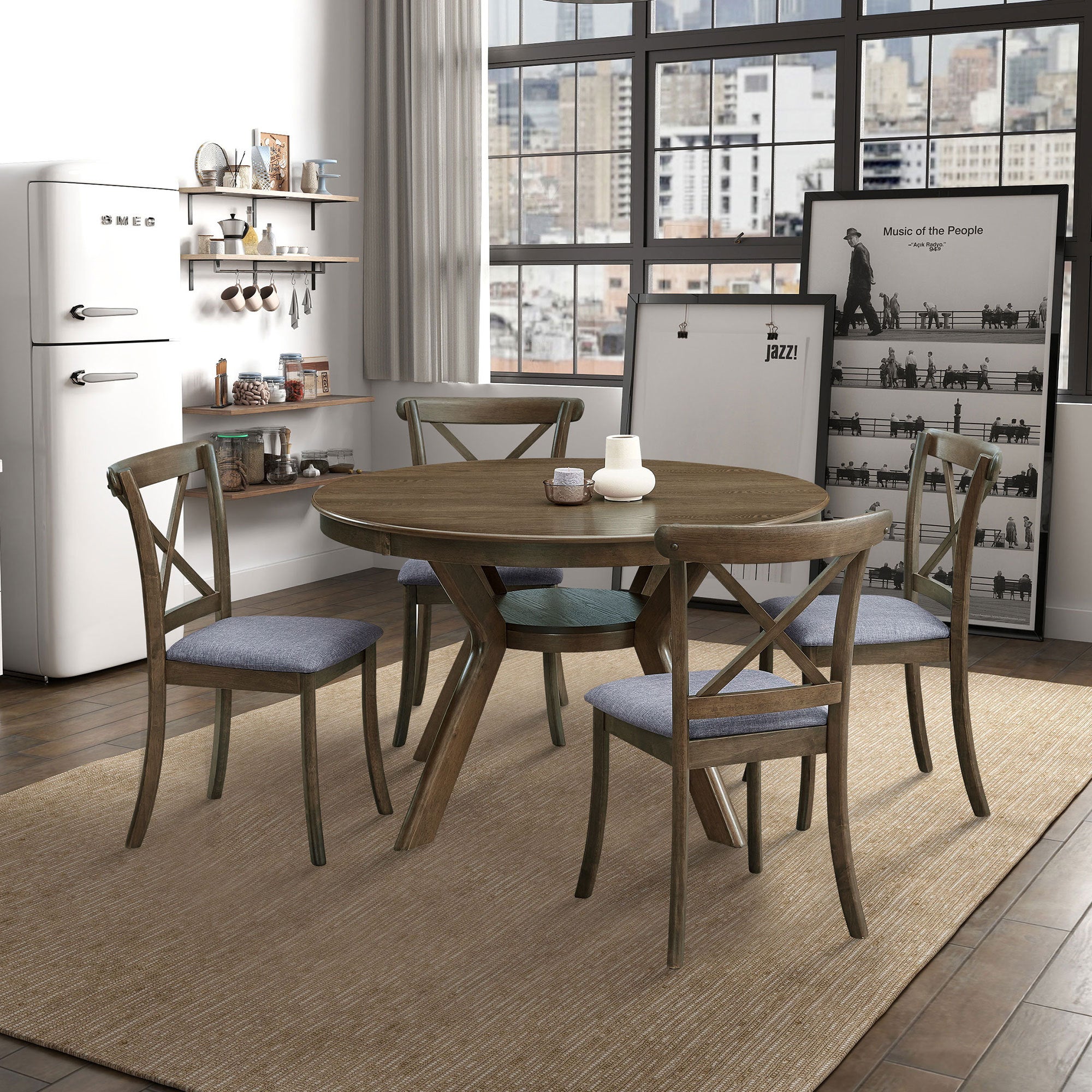 Round oak dining table set with four cross-back chairs in a styled loft dining area