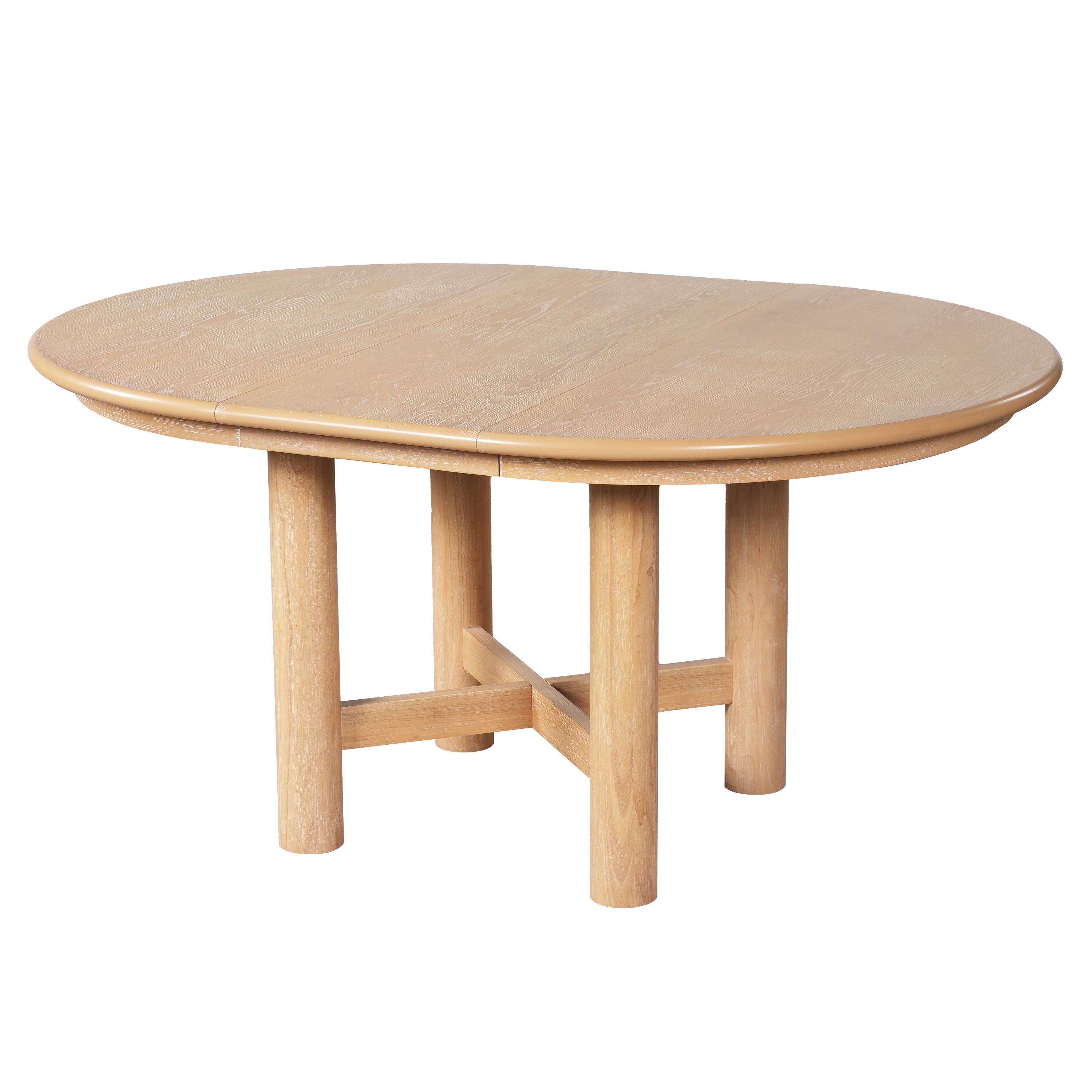 Three-quarter studio view of oak-veneer oval extendable dining table with caramel edge and round legs