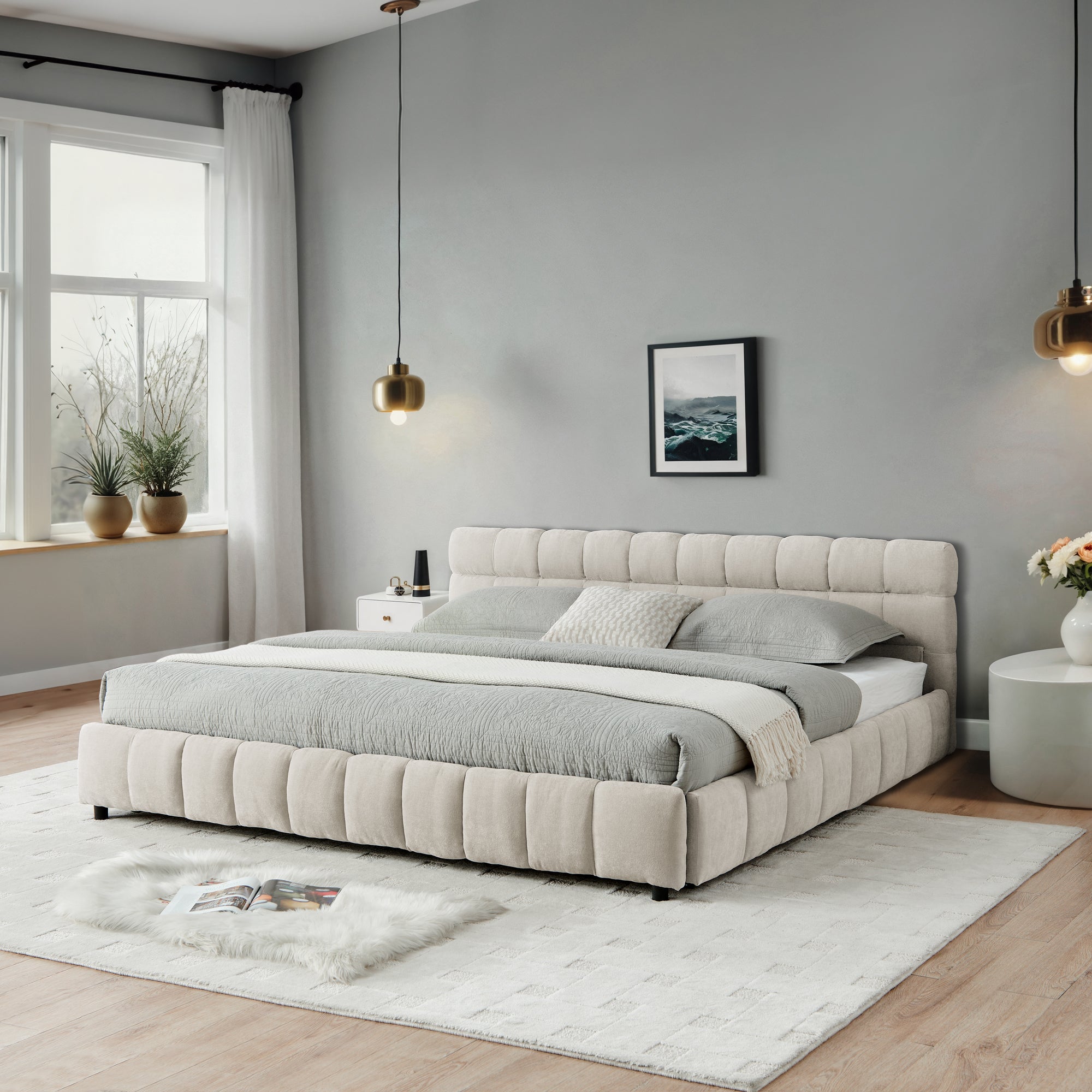 Wide bedroom shot of beige chenille storage bed with two pendant lights