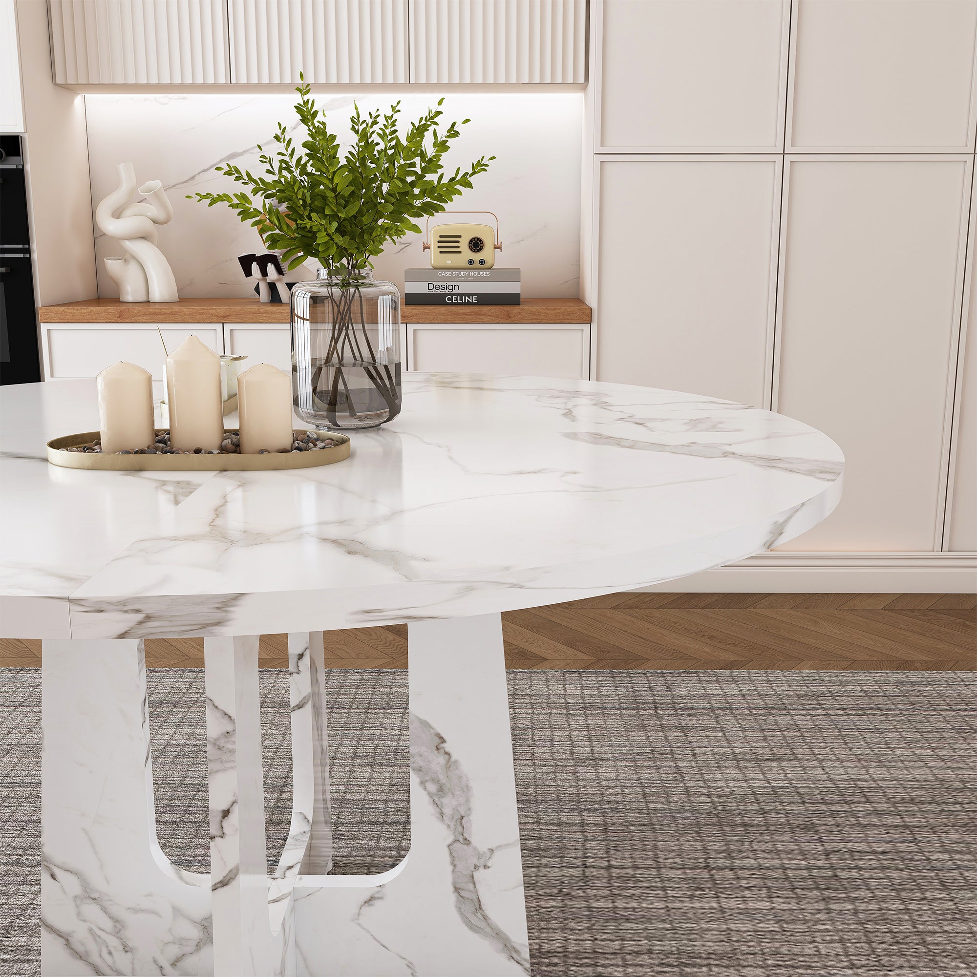Styled close-up of the faux marble tabletop edge with candles and a glass vase