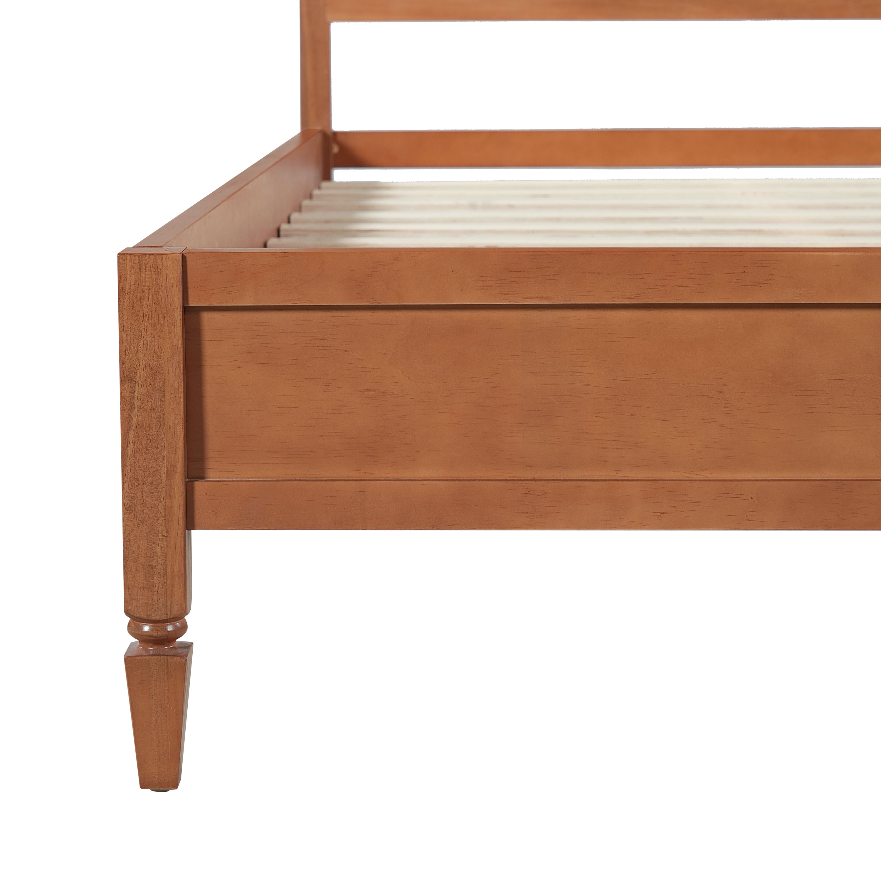 Studio corner view of the brown platform bed frame with a turned tapered leg and side rail