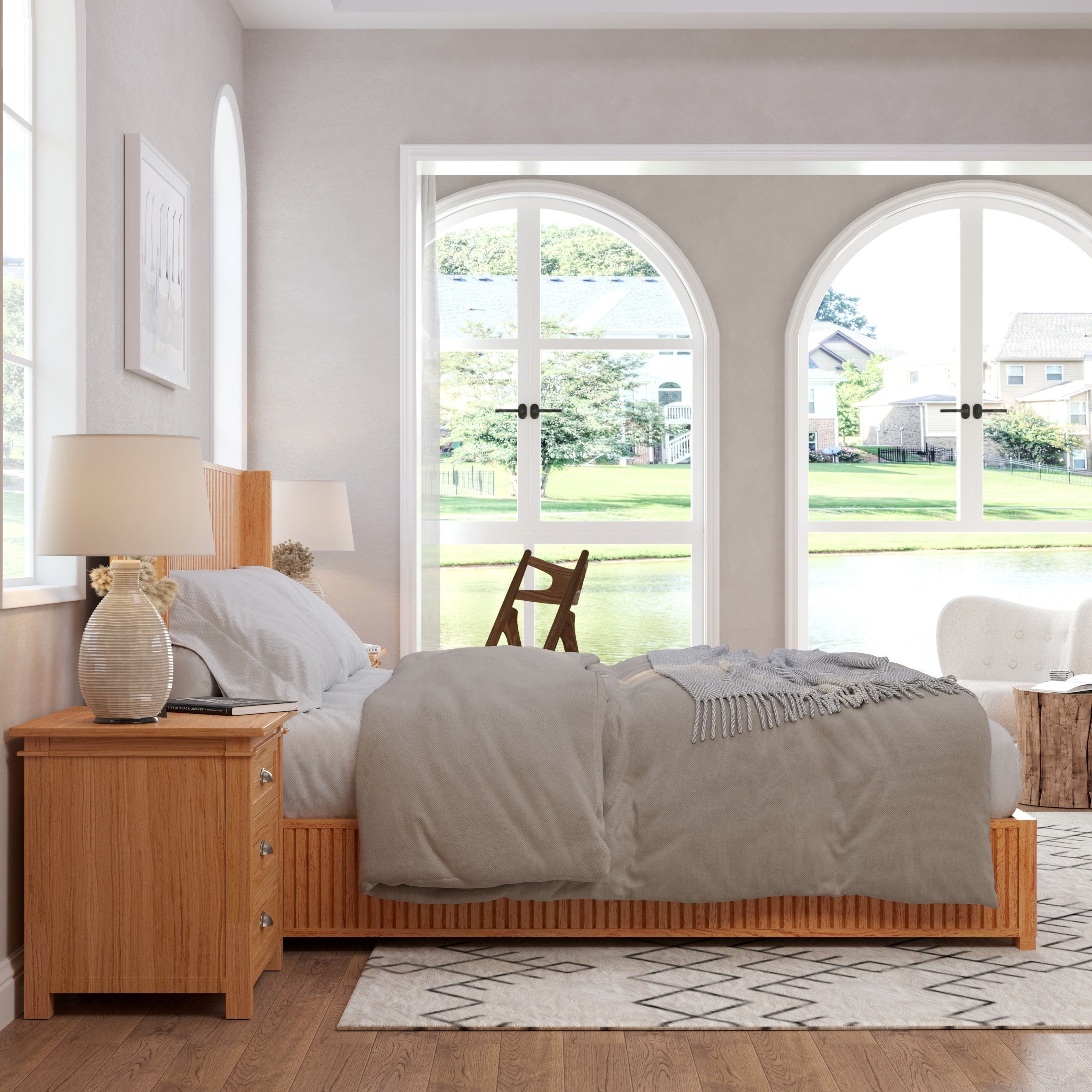 Natural wood king bed frame in bedroom with arched garden-view windows