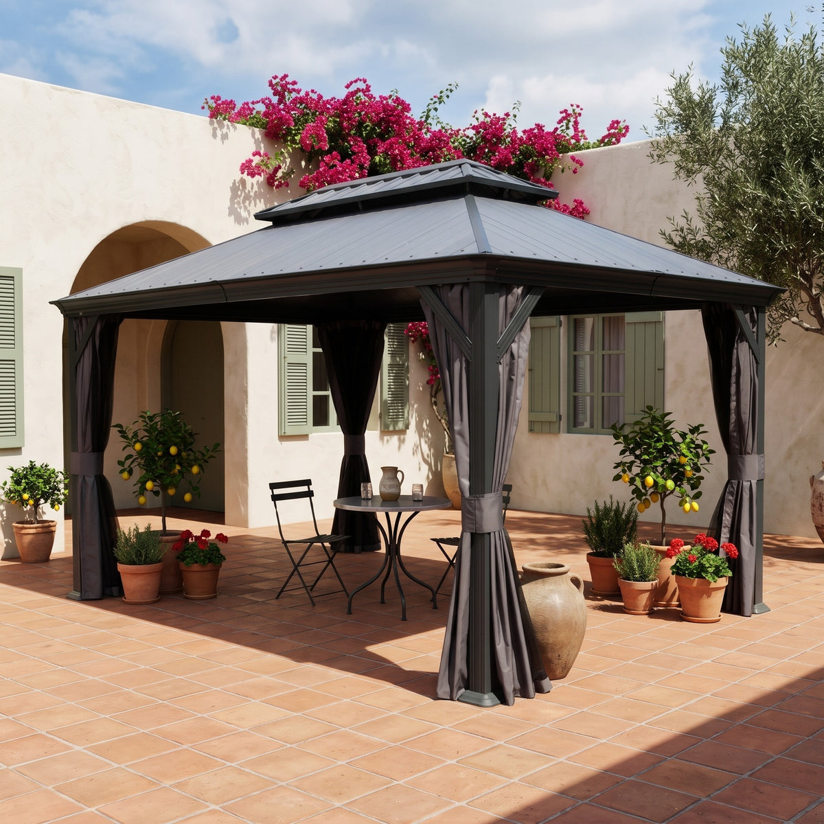 Dark gray 12x16 hardtop gazebo with tied back curtains over a bistro table on a terracotta courtyard