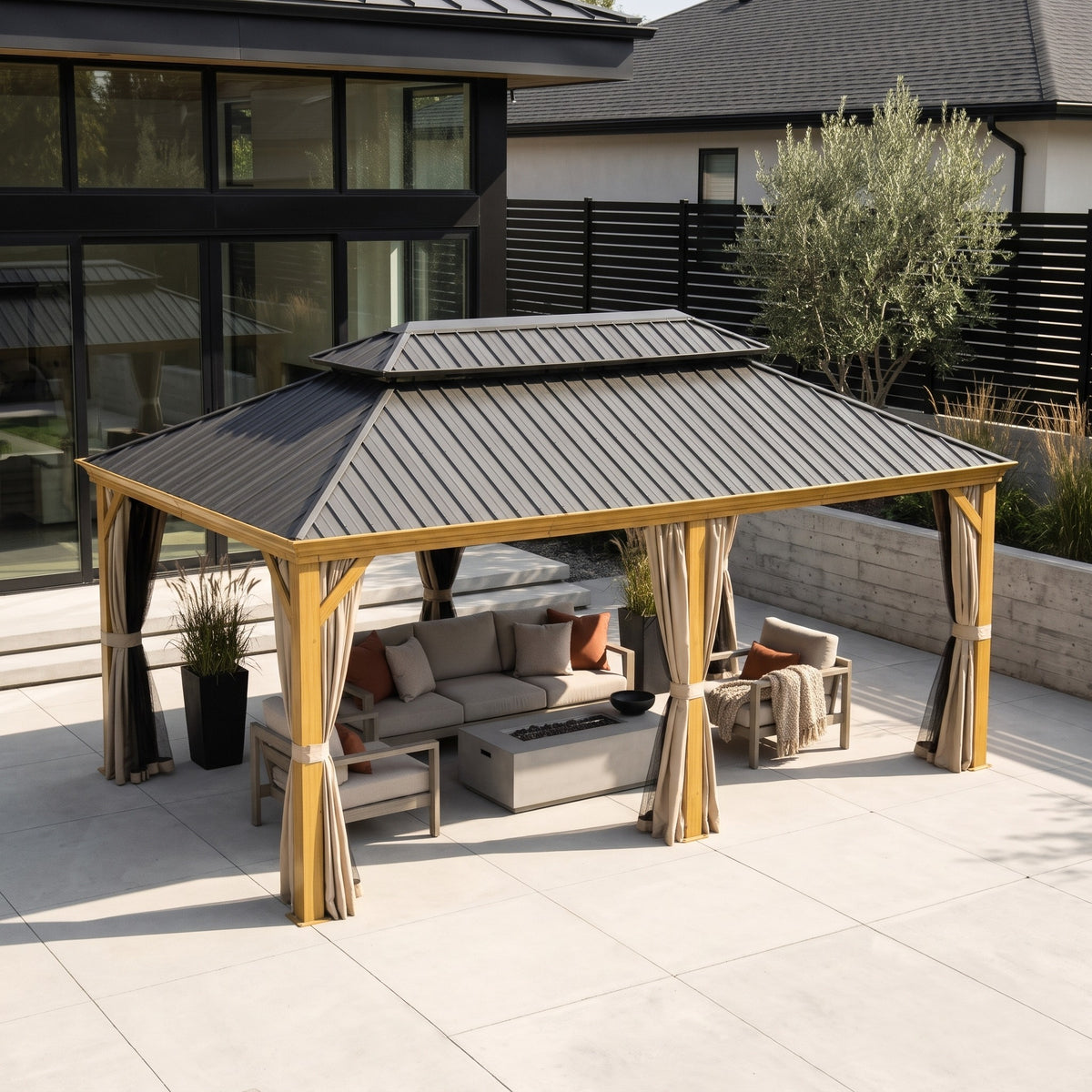 Wood grain aluminum 14x20 hardtop gazebo with grey double roof and beige curtains over patio seating in daylight