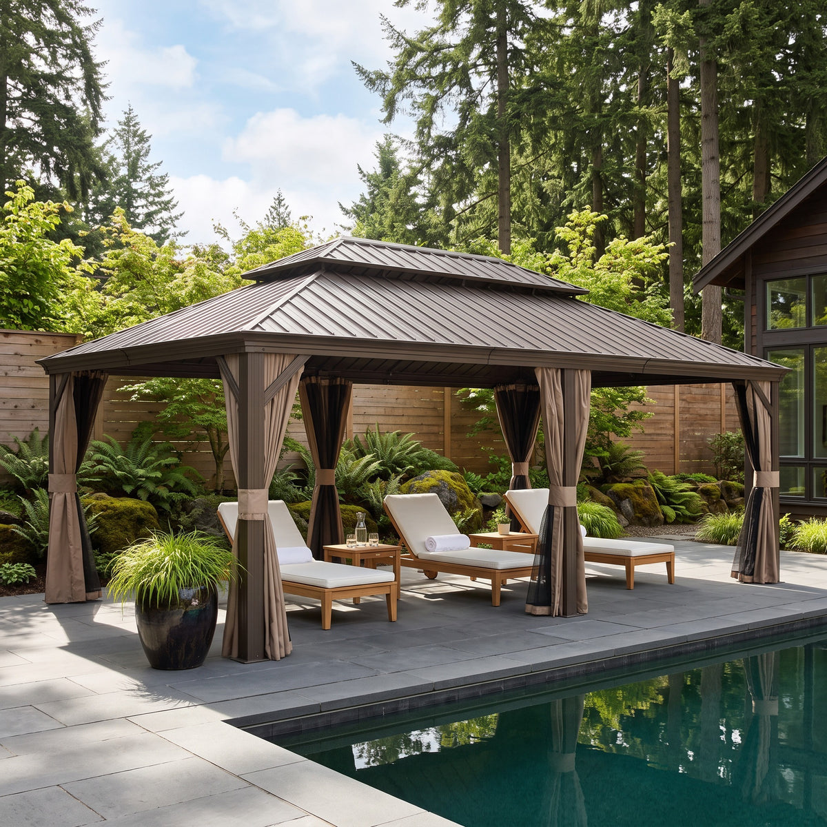 Brown aluminum 14x22 double roof hardtop gazebo with tan curtains over teak loungers beside a pool