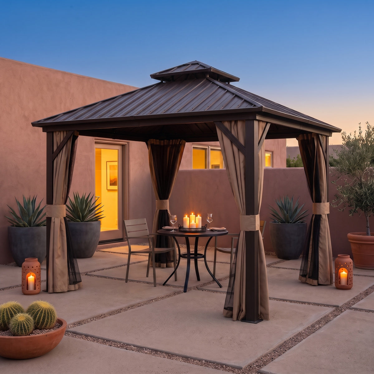 Brown aluminum 8x8 double roof hardtop gazebo with tied back curtains over a bistro table on a desert patio at dusk