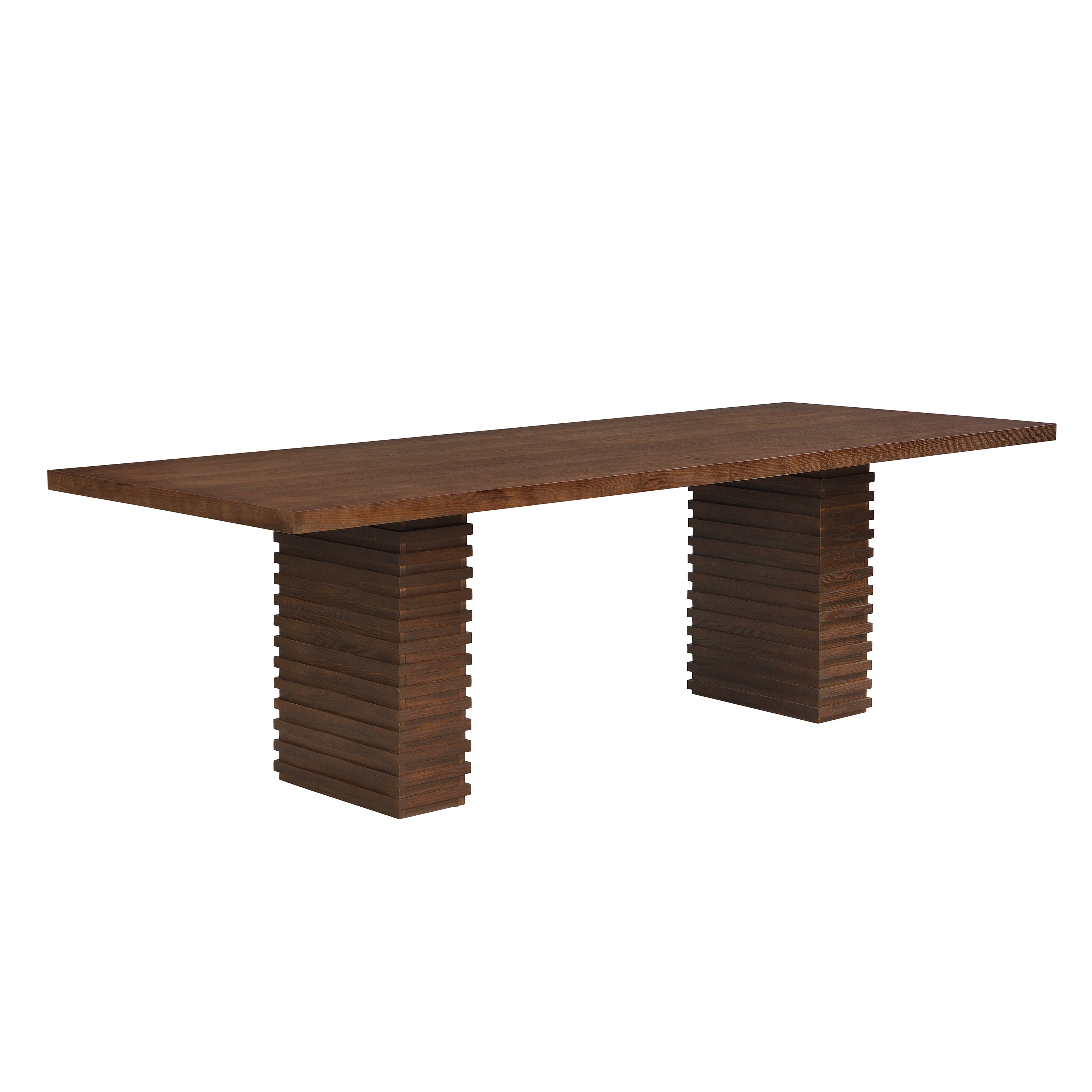 Three-quarter studio view of the walnut dining table on two stacked-slat pedestal bases, white background