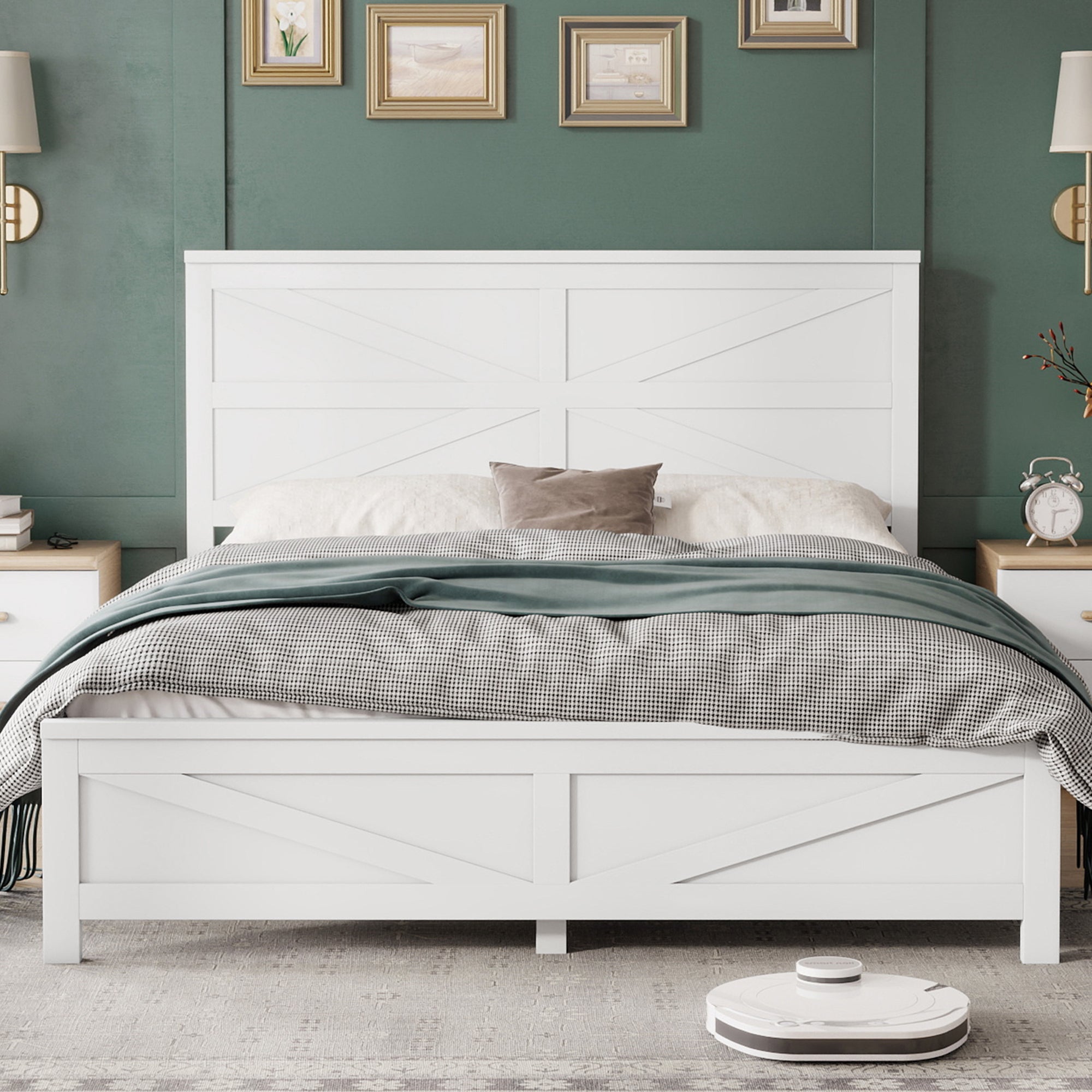 Front view of a white barn door queen bed frame with matching footboard, styled bedding, nightstands and gallery art on a green wall