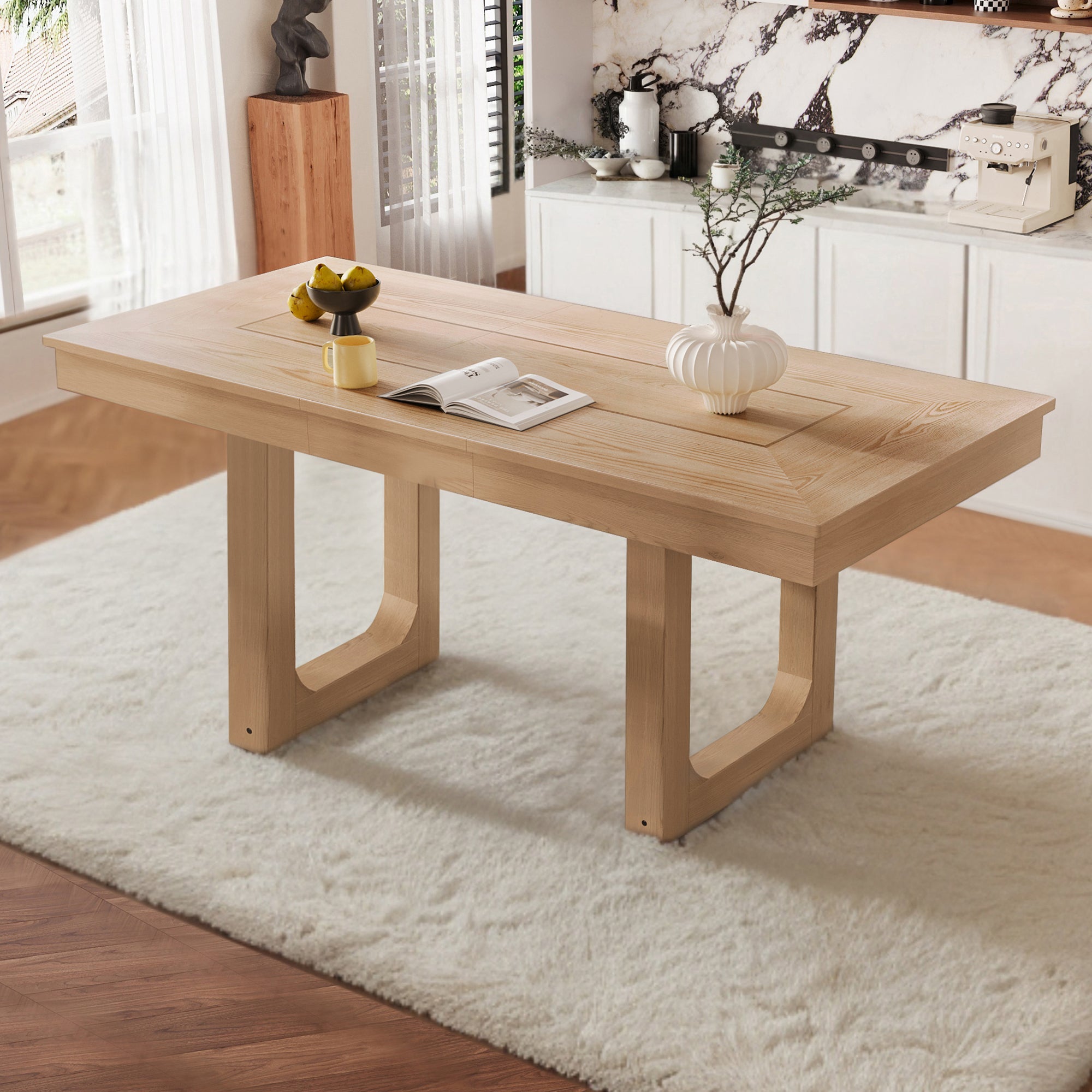 Three-quarter view of natural oak farmhouse dining table styled in a bright kitchen on a white rug