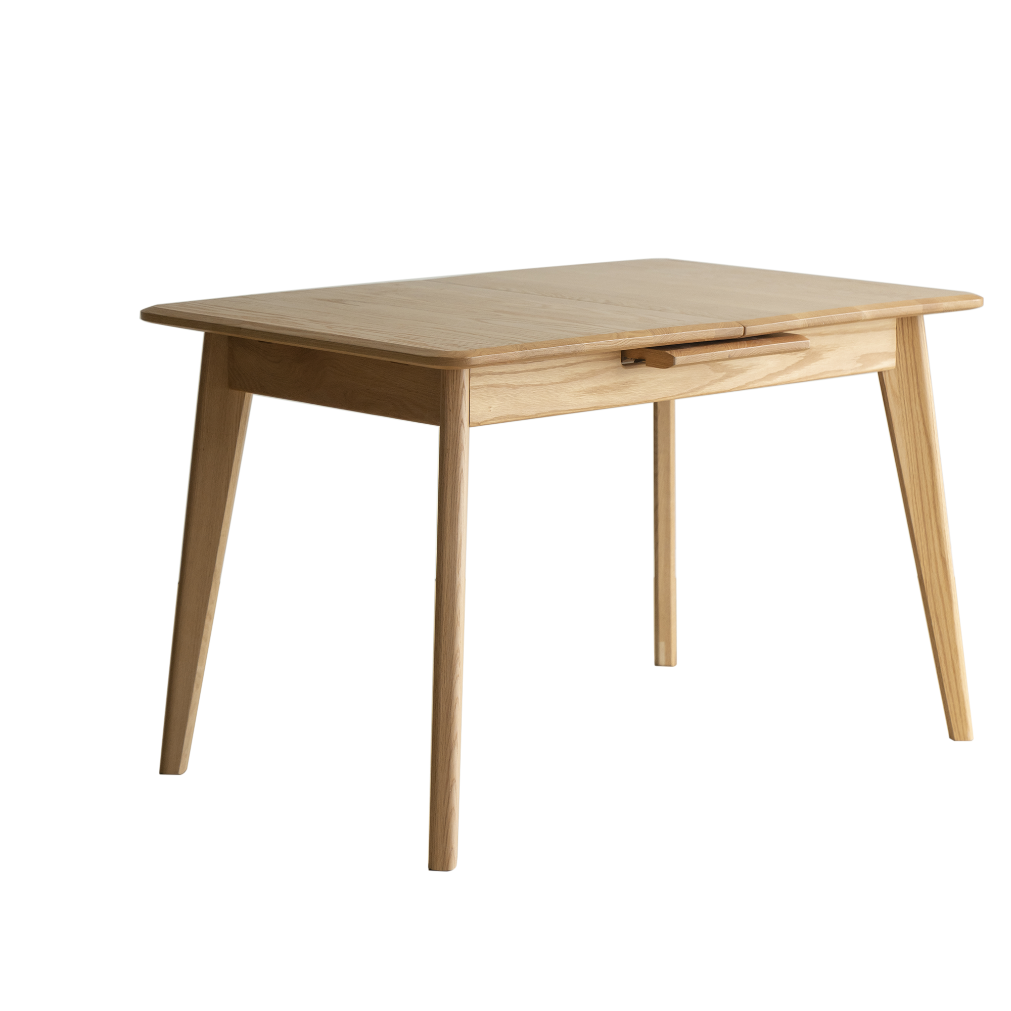 Natural oak extendable dining table with tapered legs and a center pull rail, three-quarter studio view