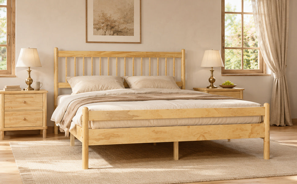 Angled view of the natural pine bed with spindle headboard and footboard and cream bedding #Color_Natural