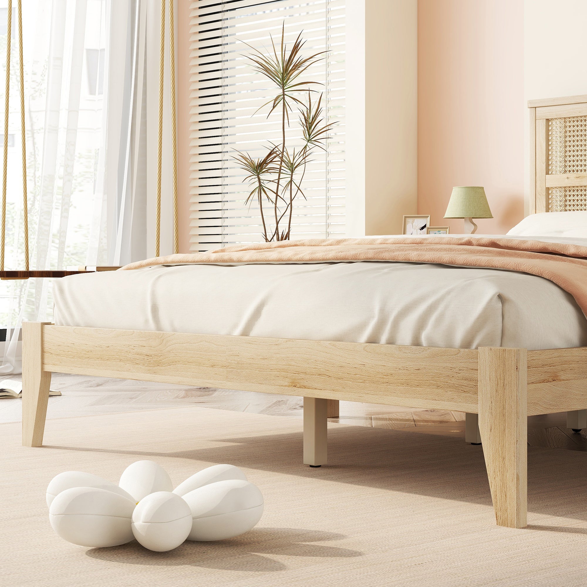 Foot-of-bed view of the rubberwood bed frame showing the open clearance and support legs underneath