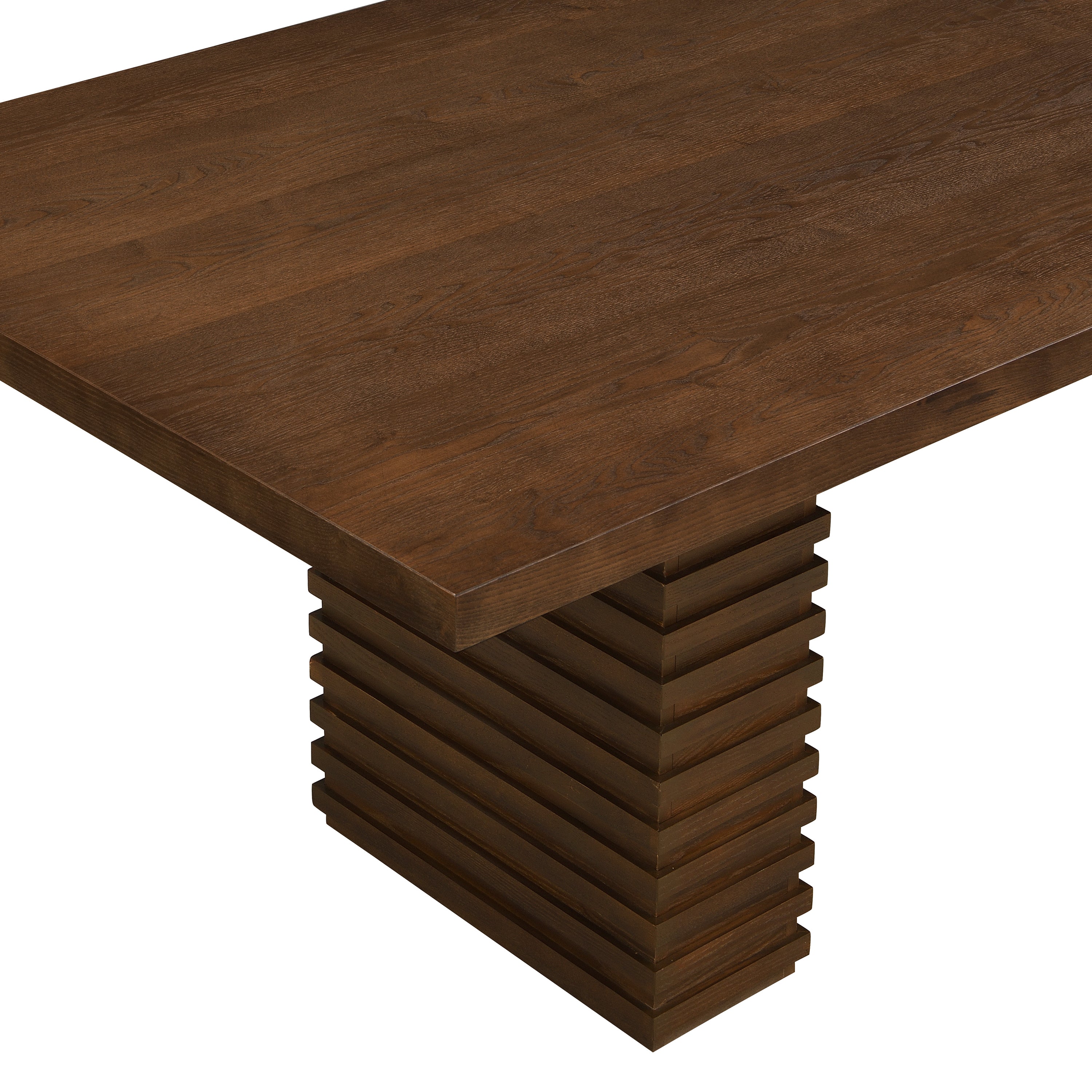 Close-up of a tabletop corner above the stacked-slat pedestal base on the walnut dining table