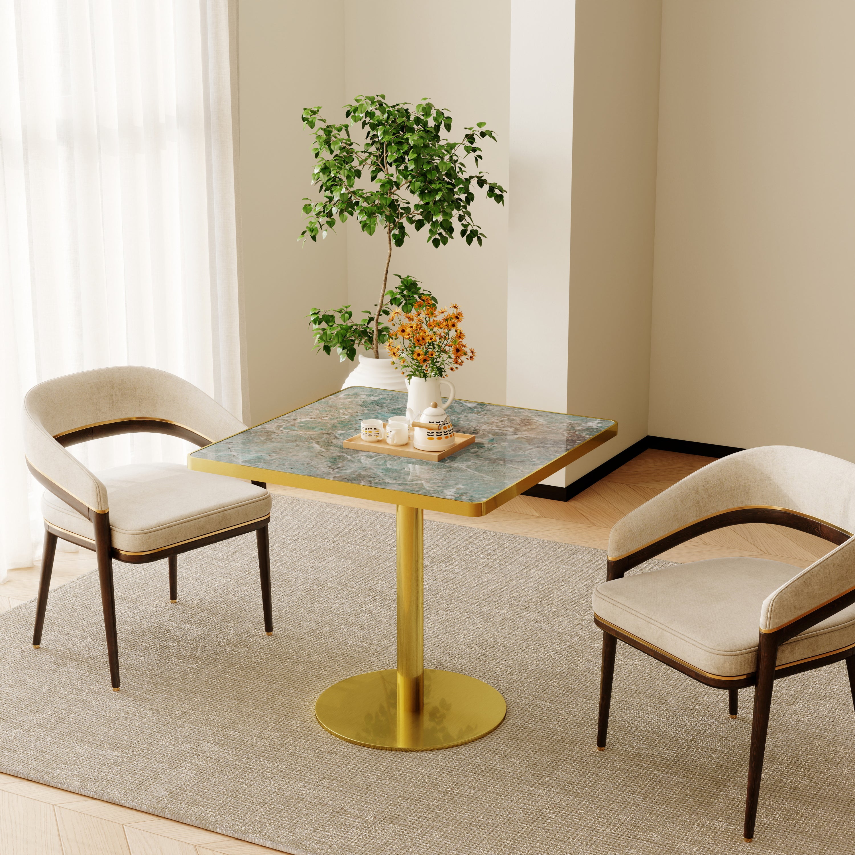 Gold and green sintered stone square table in a bright dining nook with two cream chairs