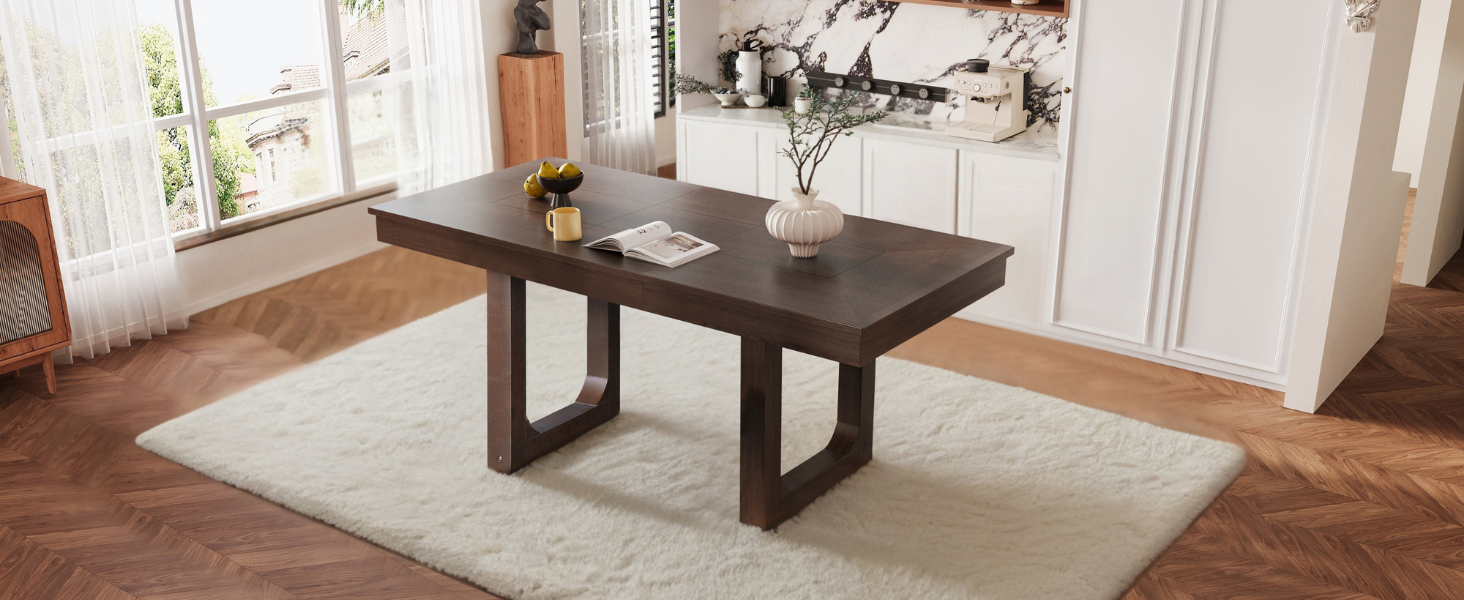 Wide three-quarter room view of the walnut extendable dining table on a plush rug