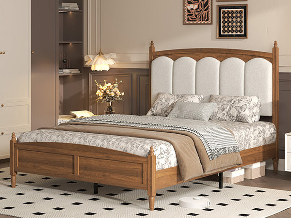 Angled bedroom scene of the brown wood vintage queen bed with cream arched headboard and turned posts