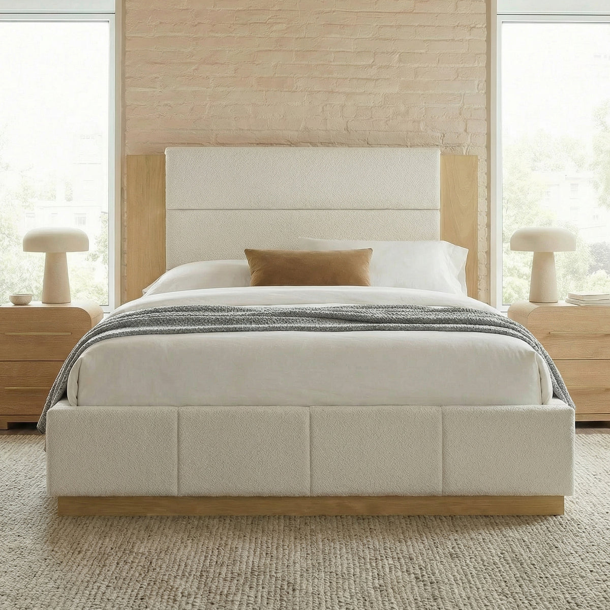 Styled white boucle queen bed with padded headboard panels framed in light oak