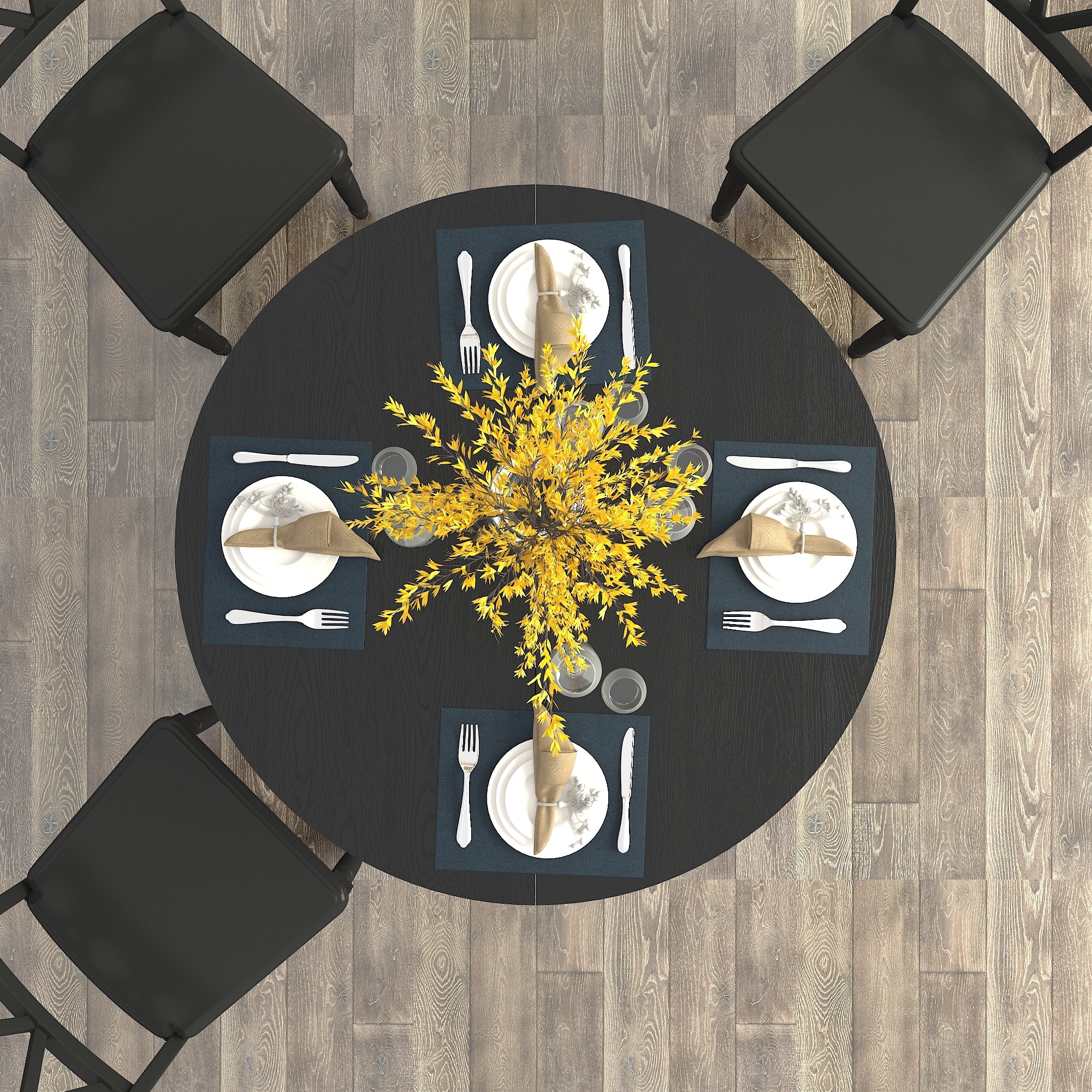 Overhead view of the round black table with four blue placemats and a yellow flower centerpiece