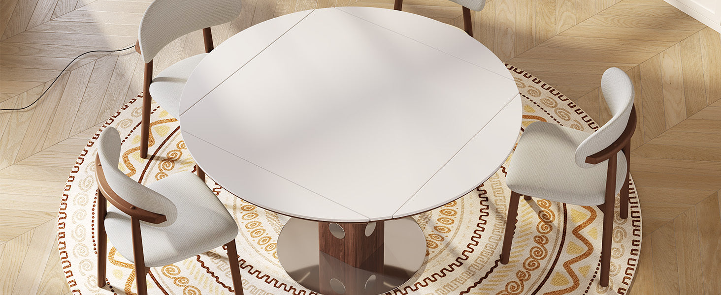 Overhead styled view of the round white table set with four cream chairs