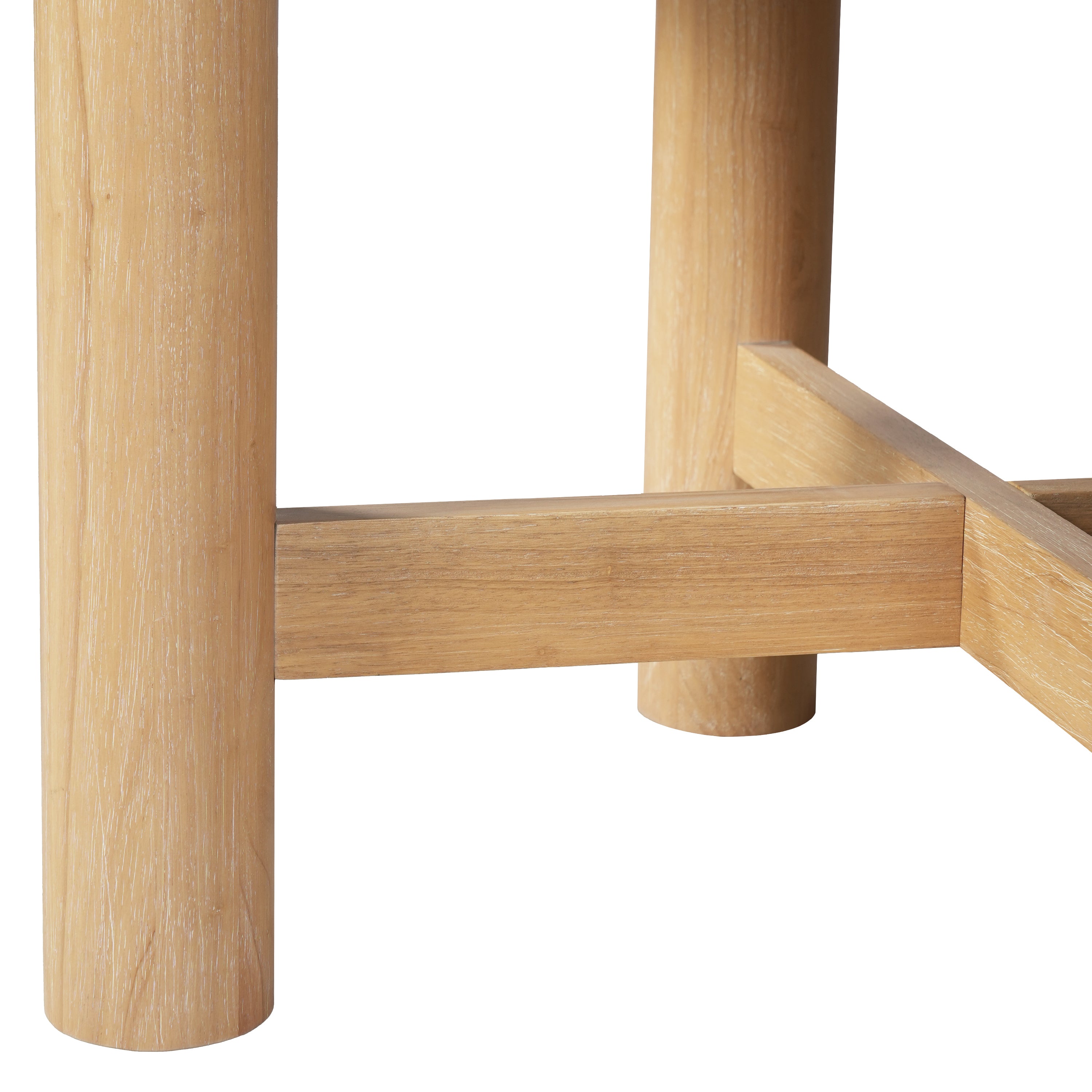 Close-up of a round oak leg meeting the flat X-shaped stretcher