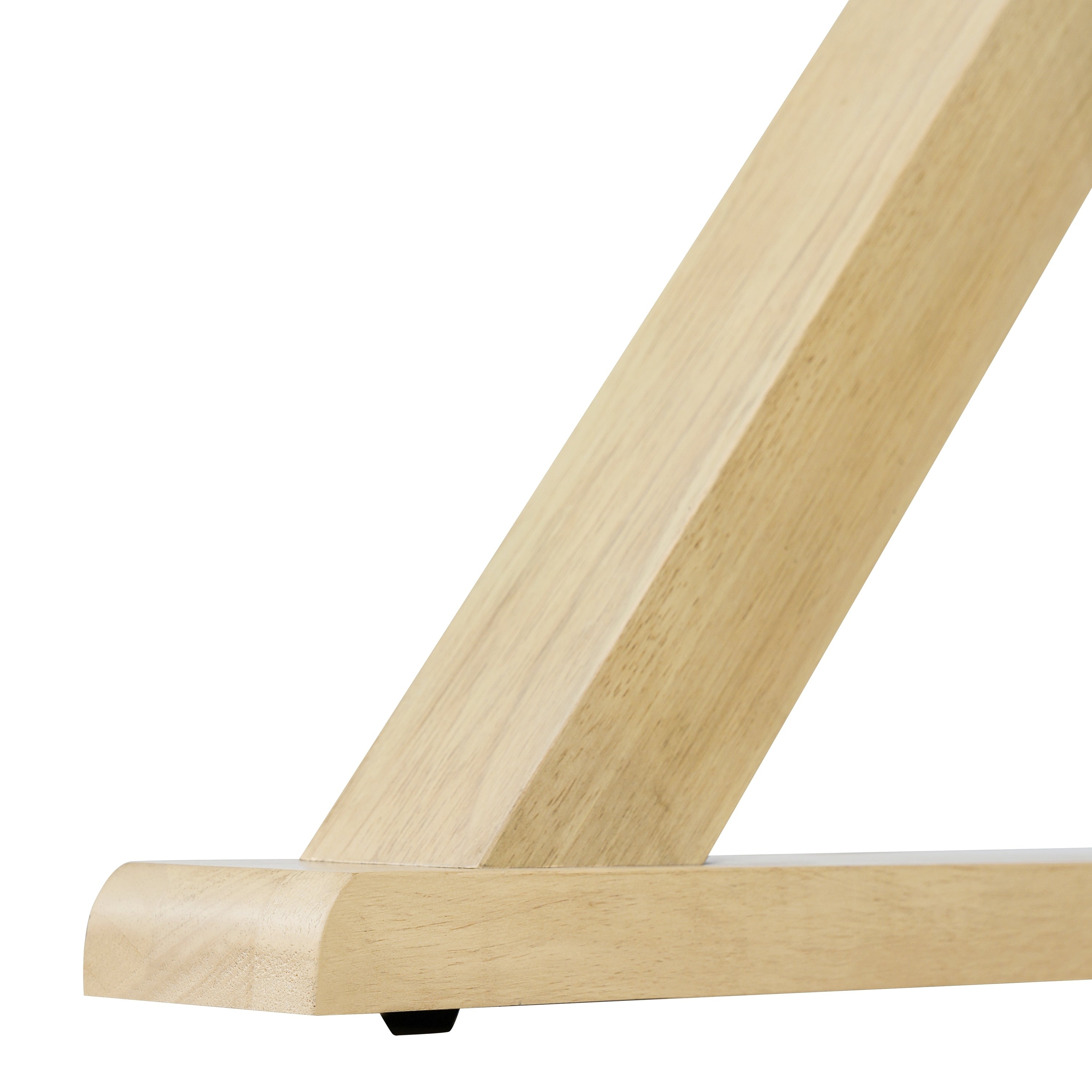 Close-up of an oak X-leg foot with black floor glide, plain white background