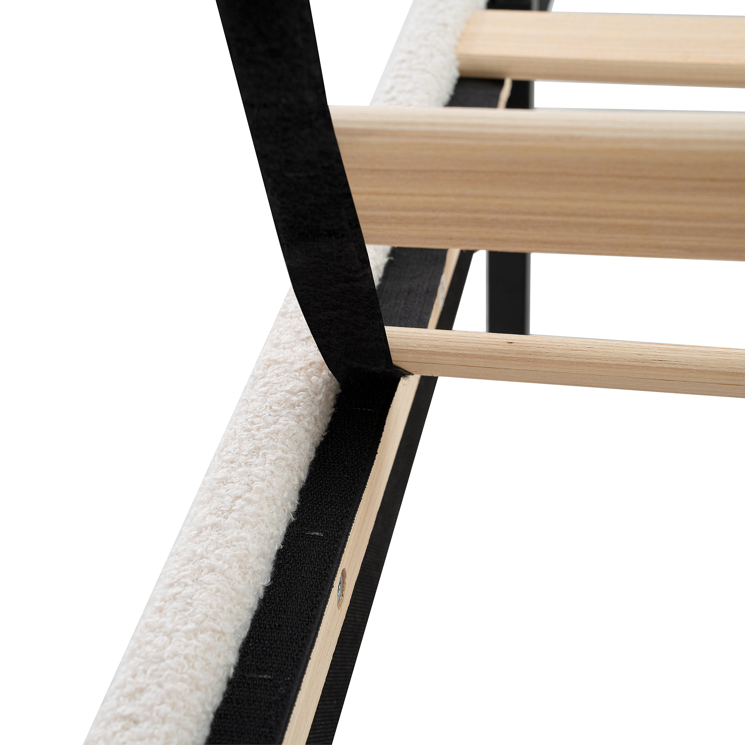 Close-up of white teddy velvet fabric texture on king bed frame
