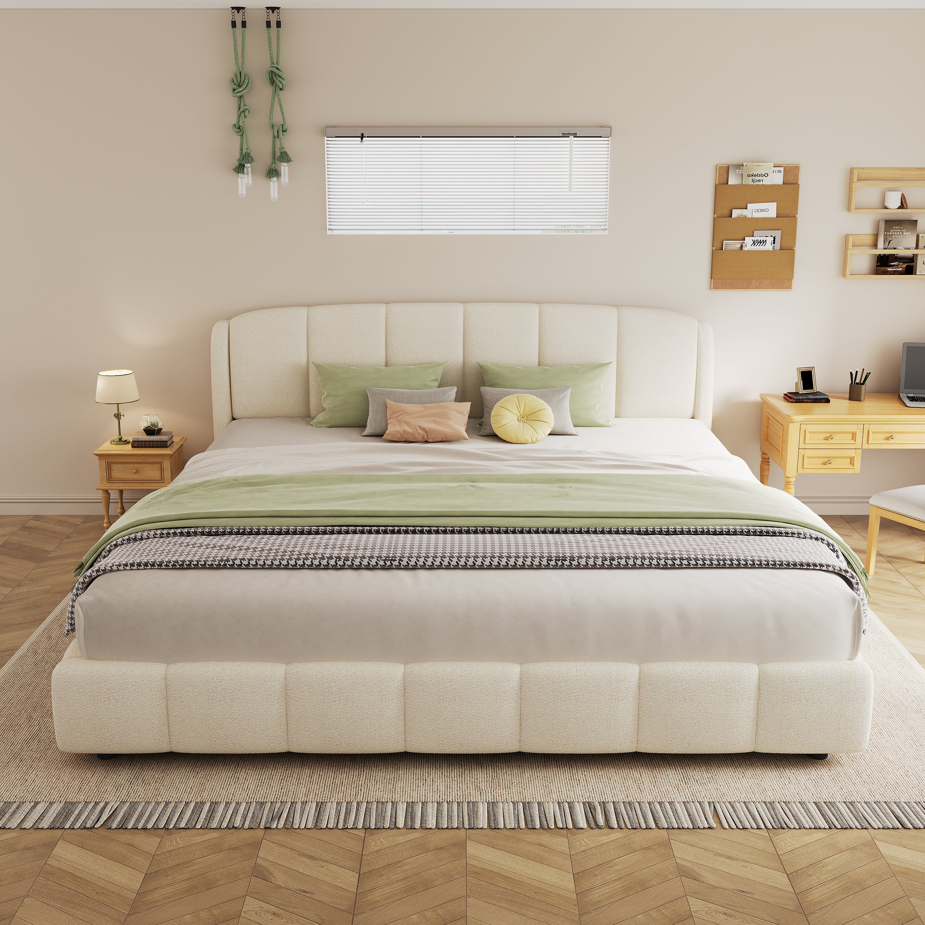 Beige bouclé king platform bed in a bedroom with sage green throw