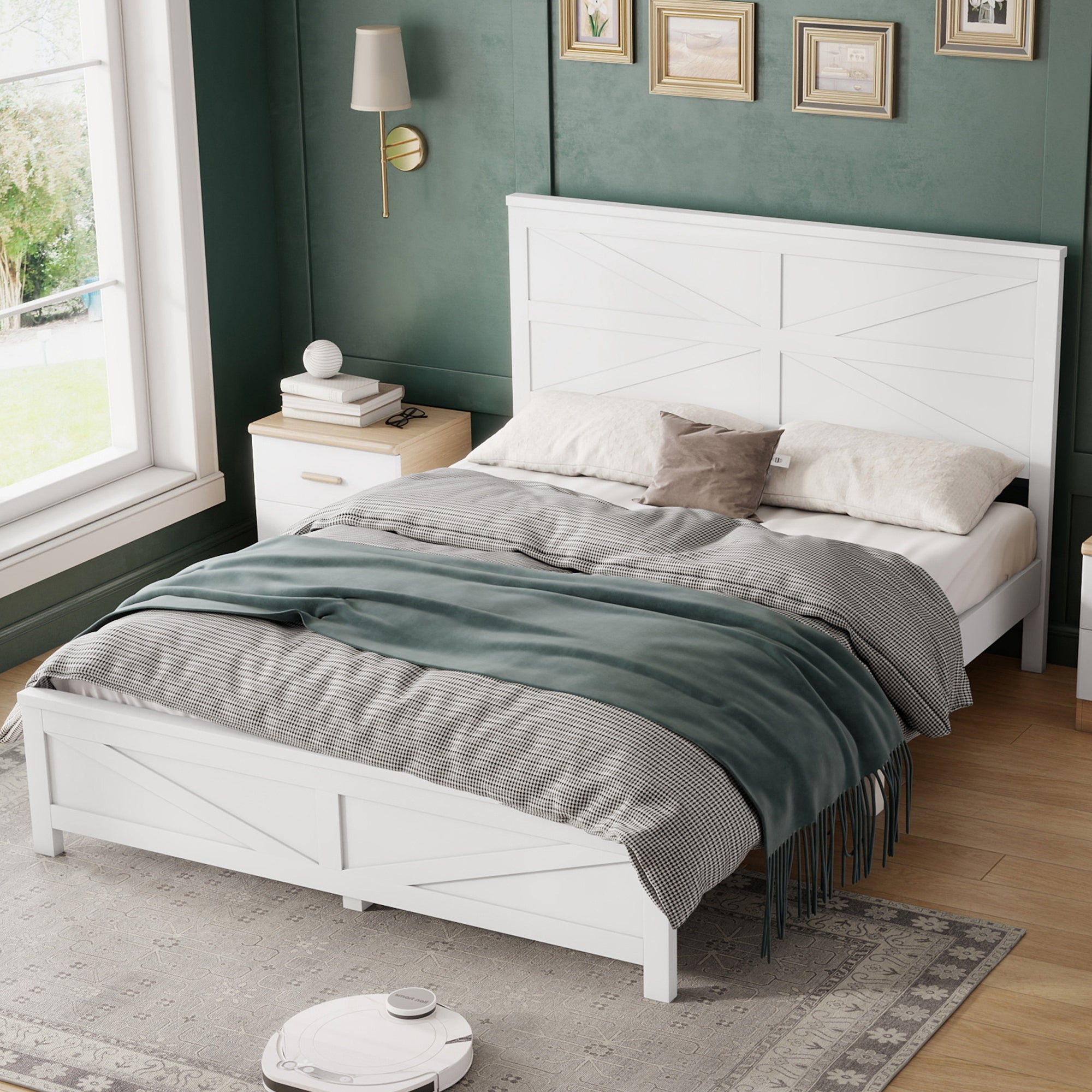 High angled view of the white barn door queen bed frame styled with a nightstand and window in a green room
