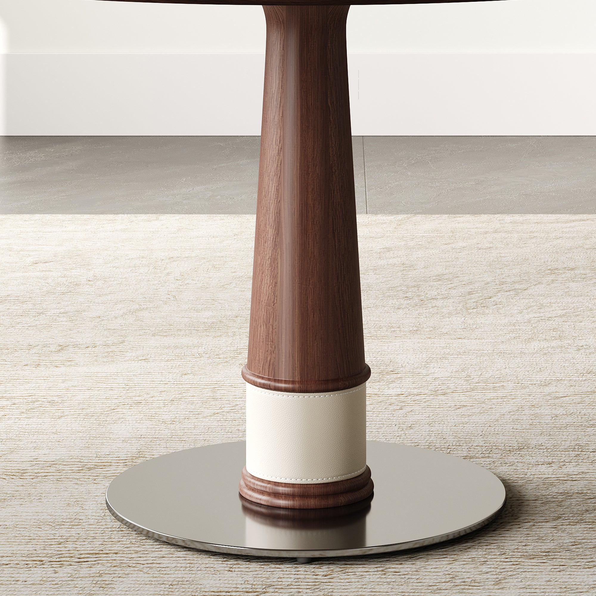 Close-up of the tapered walnut pedestal column with a cream leather band and chrome disc base
