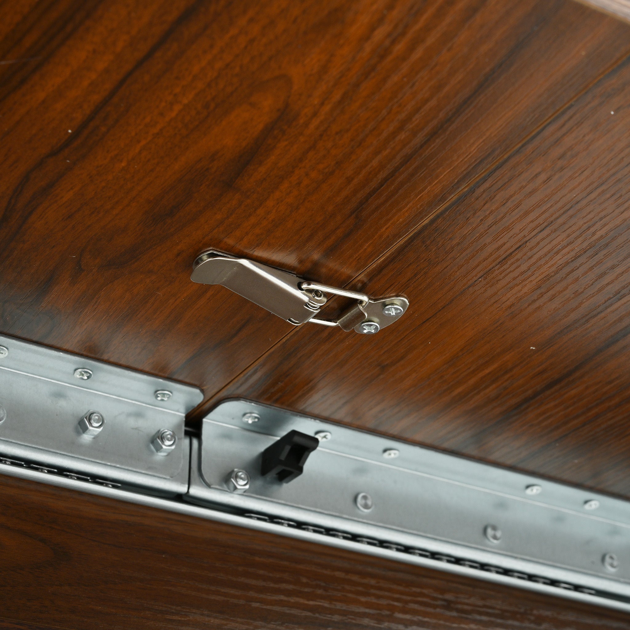 Close-up of the metal toggle latch that locks the extended tabletop