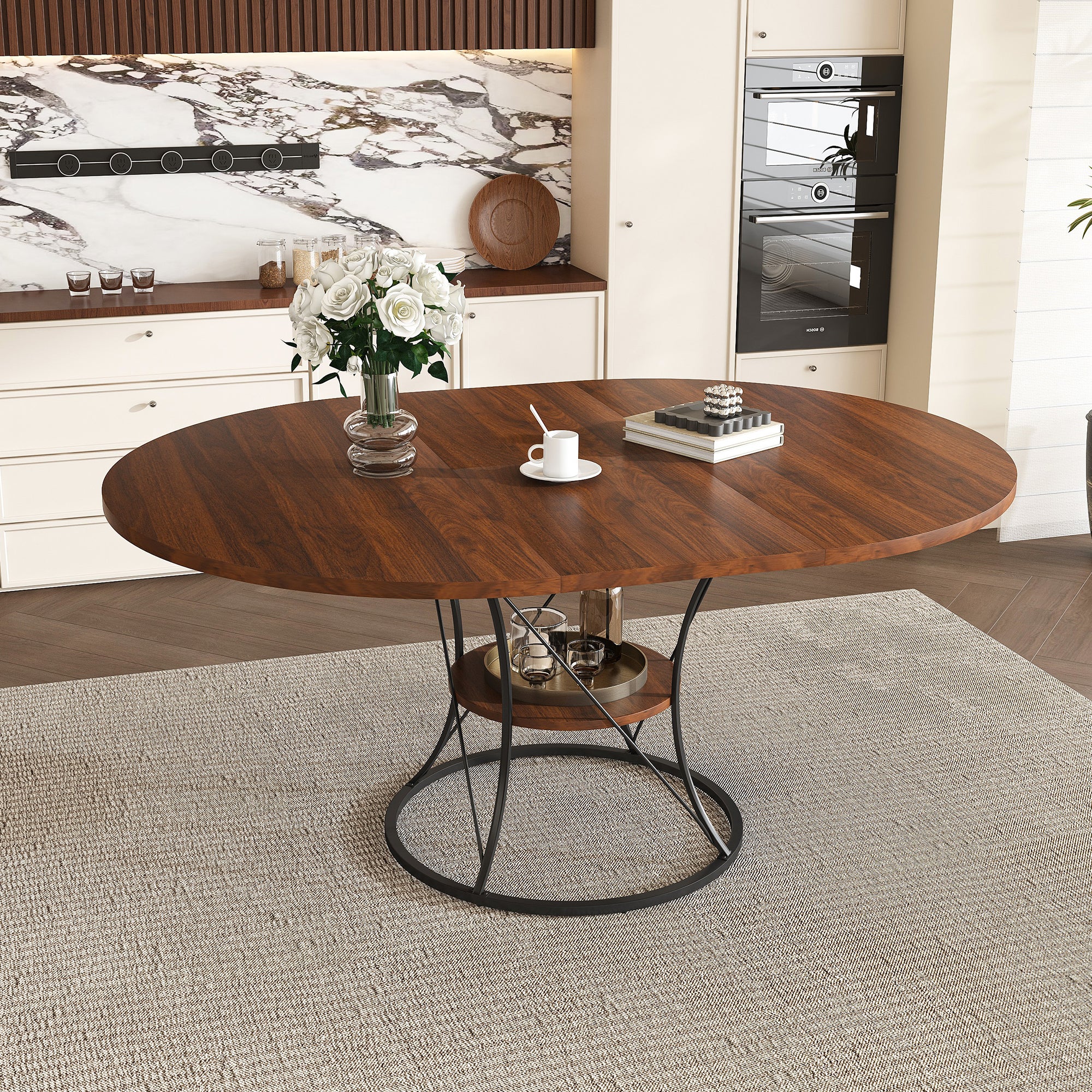 Walnut extendable round dining table with a black iron cage base and storage shelf styled in a kitchen