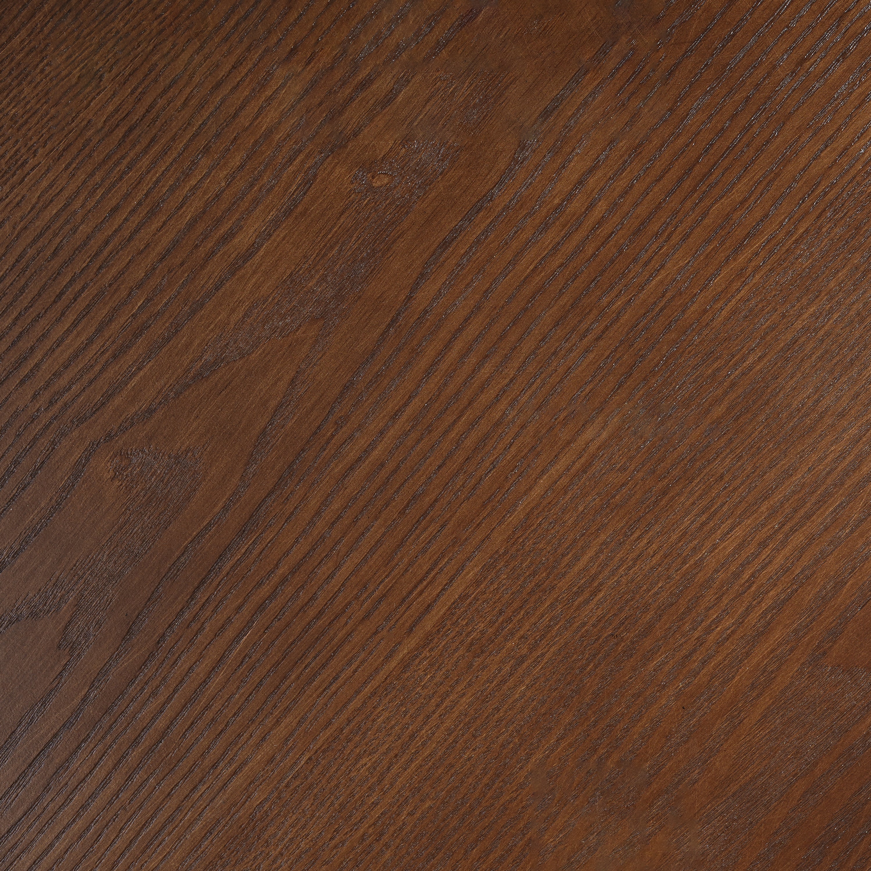 Close-up of the walnut wood-grain finish on the tabletop