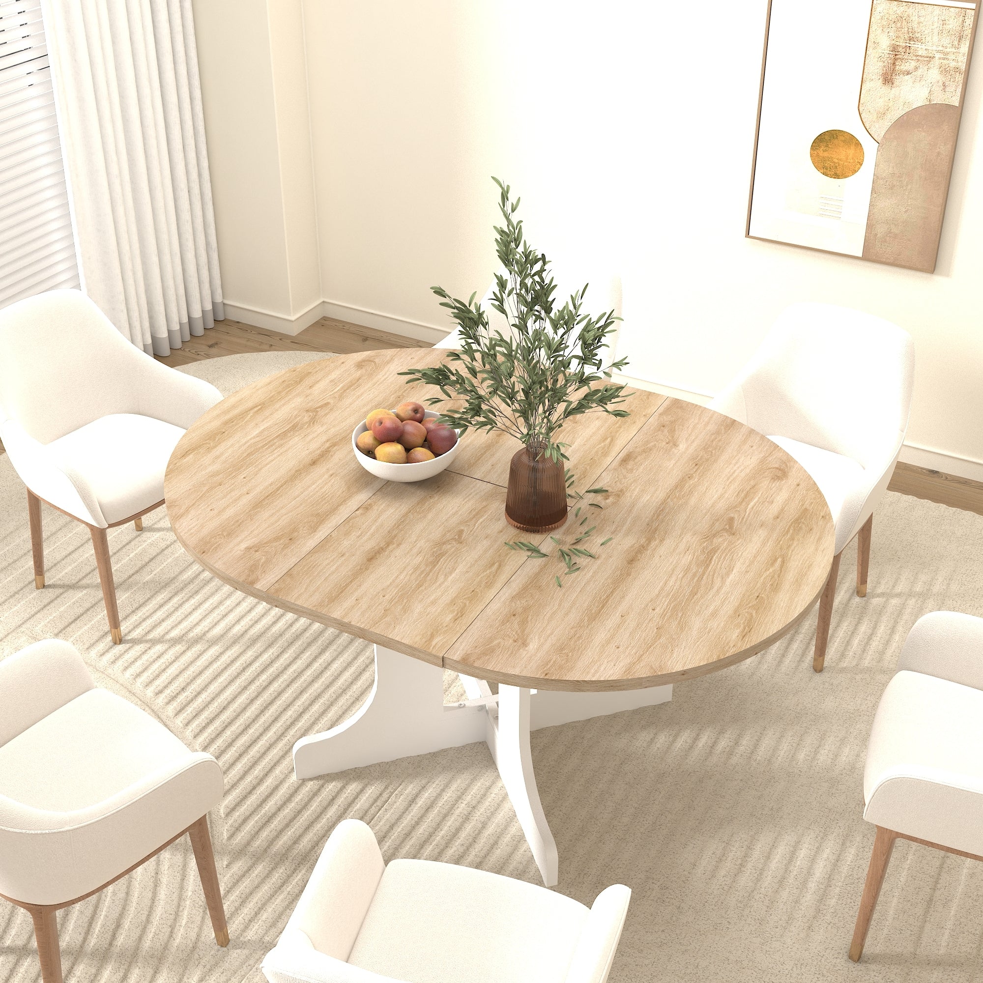 Overhead angled view of the oval oak tabletop with cream armchairs, fruit bowl and vase