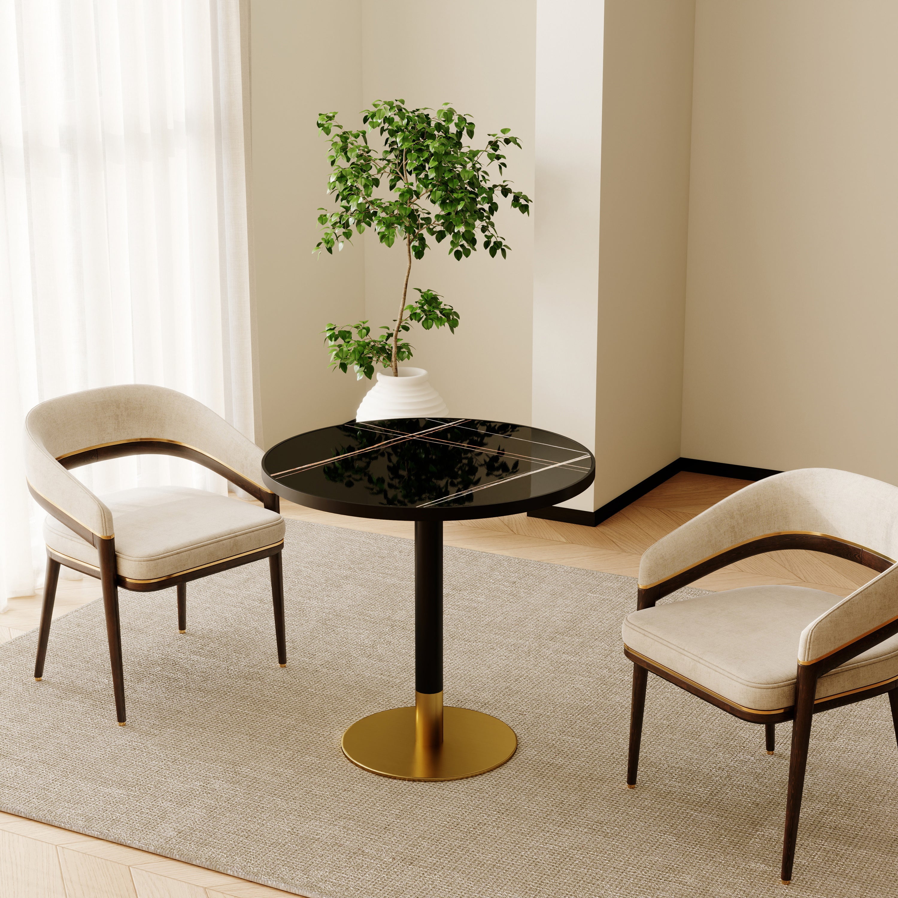 Corner room setting with the round marble-look dining table, two cream chairs and a potted tree