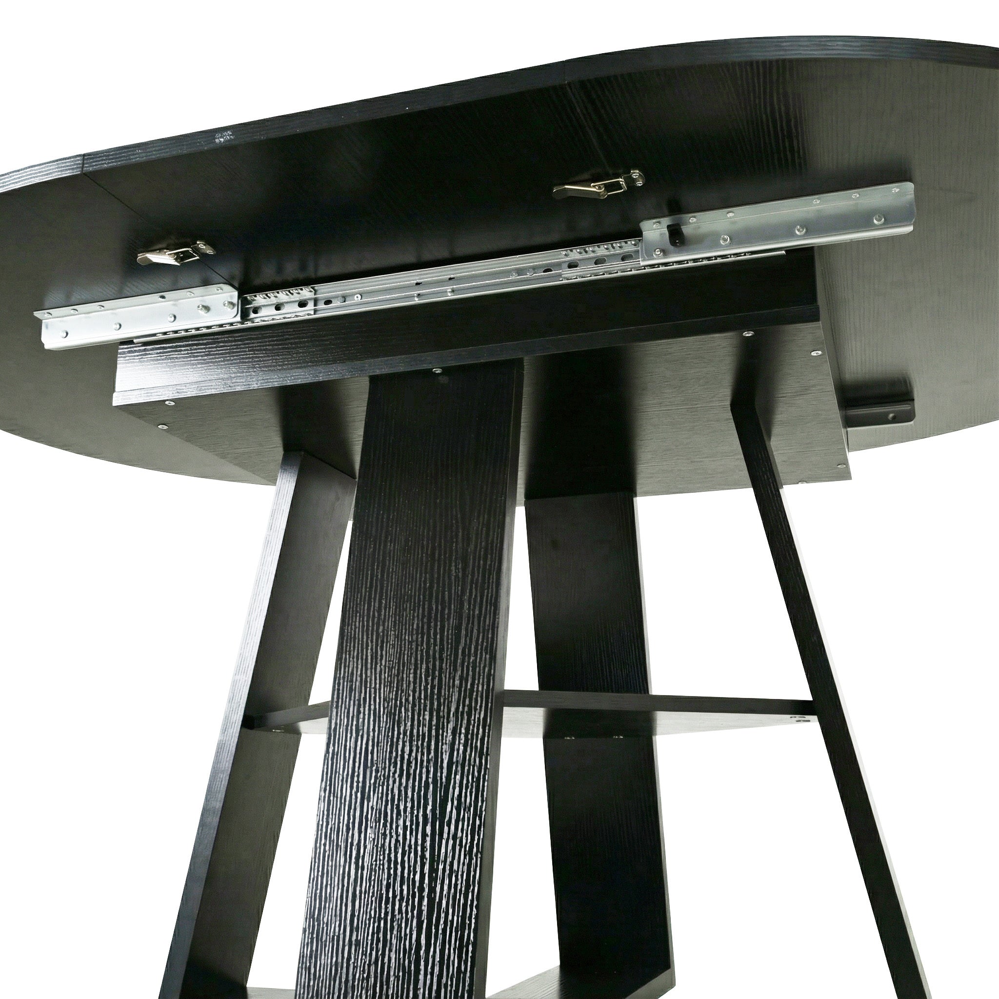 Angled studio view of the split black tabletop halves and exposed slide rails