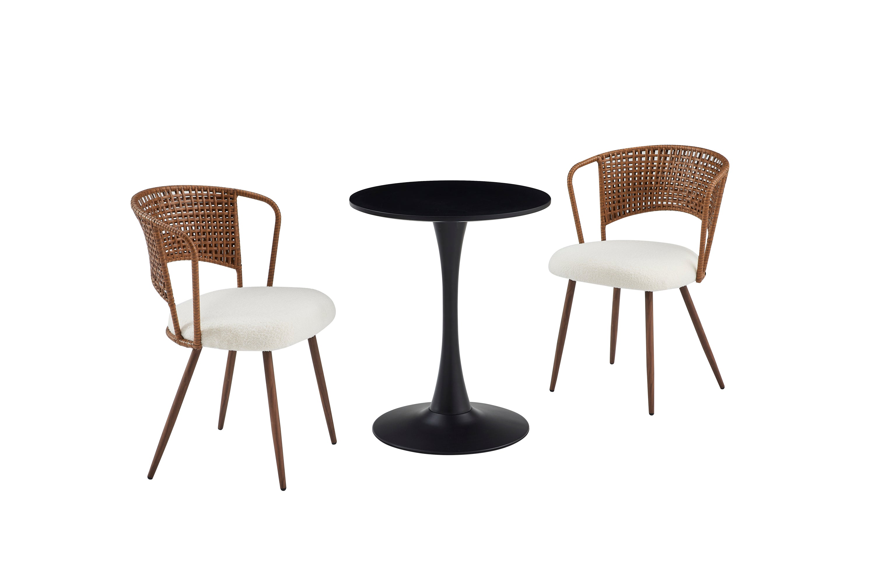 Black round dining table with two rattan and boucle chairs, white studio
