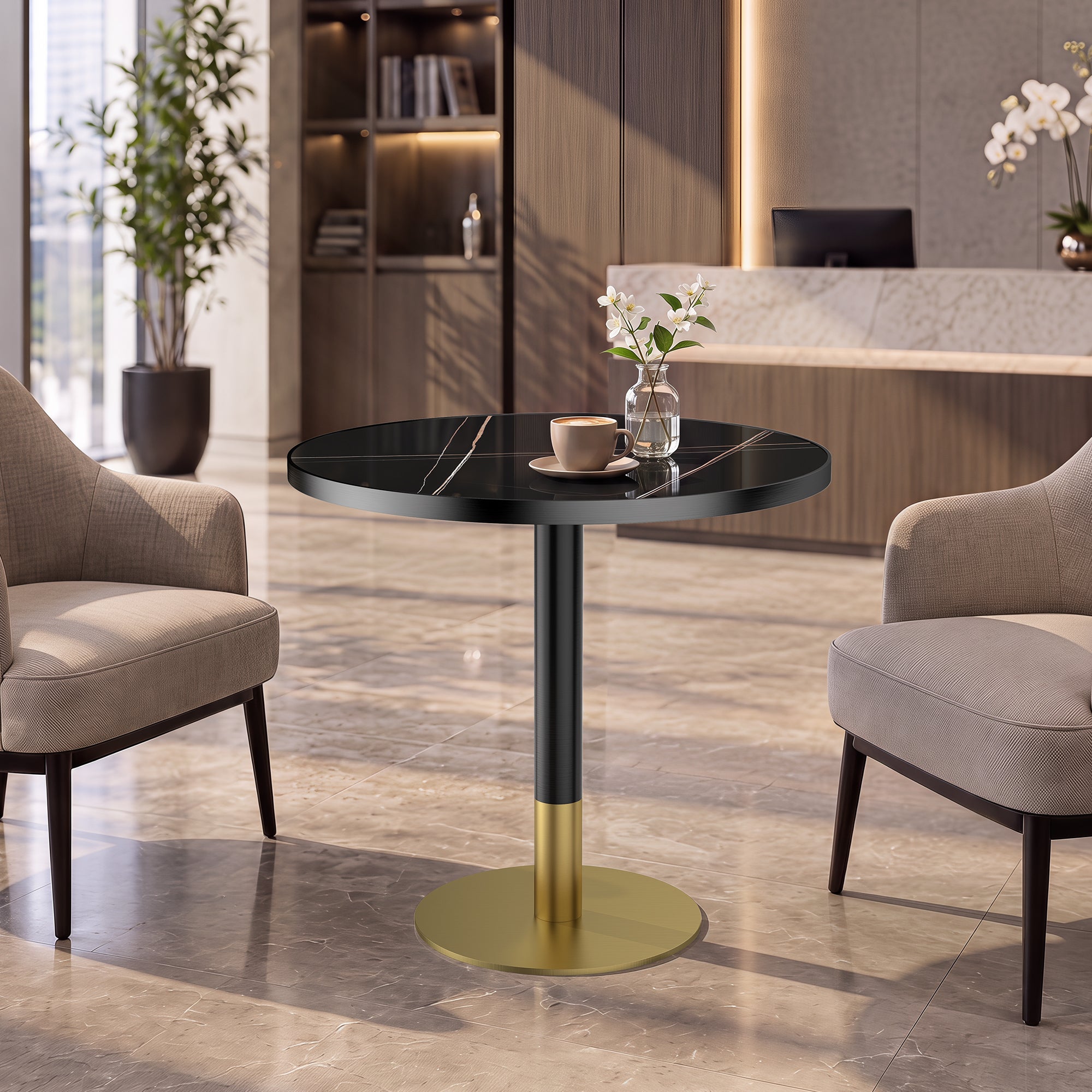 Styled lobby setting with the gold and black round dining table holding a coffee cup and flowers