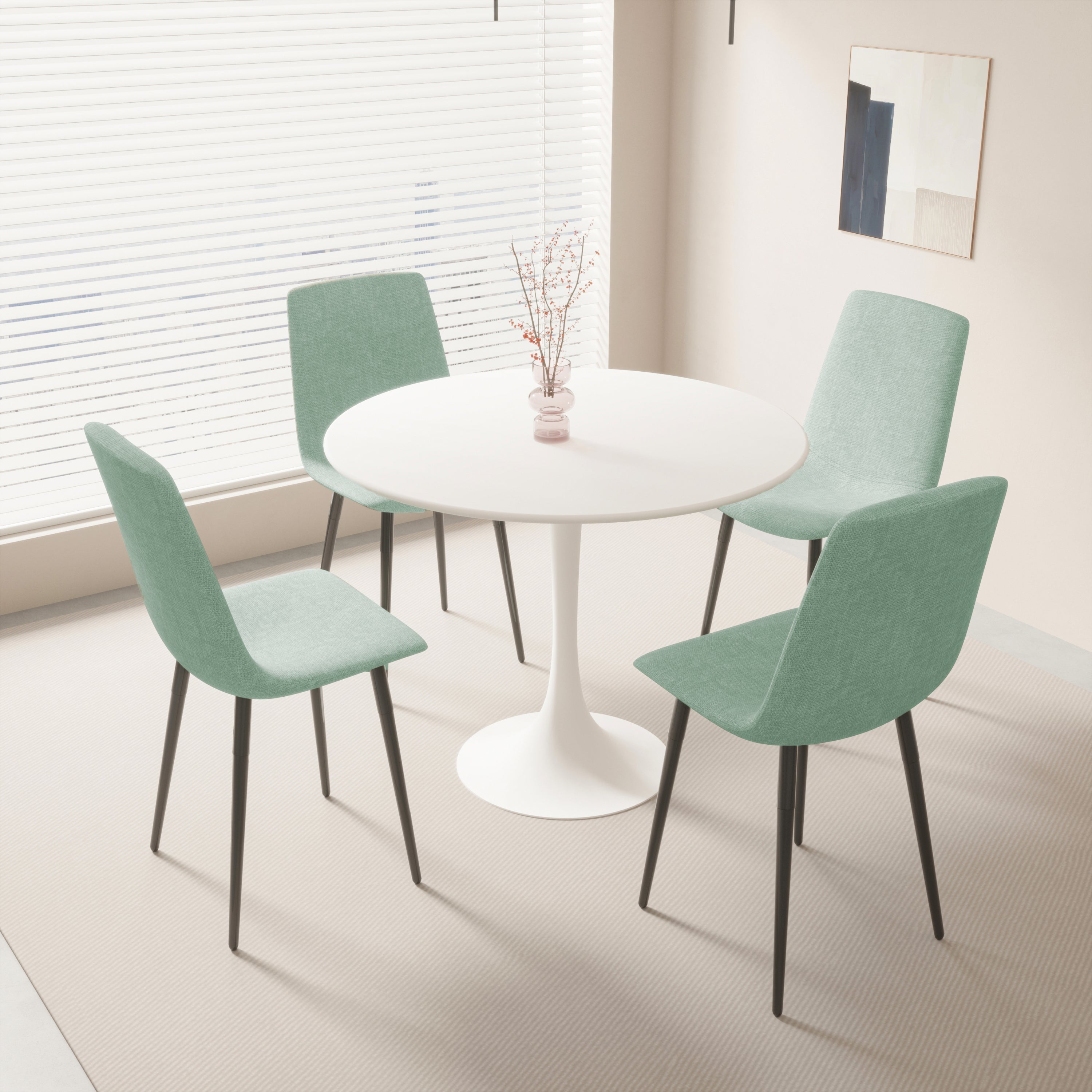 White tulip dining table with four teal chairs by a large window, full dining set