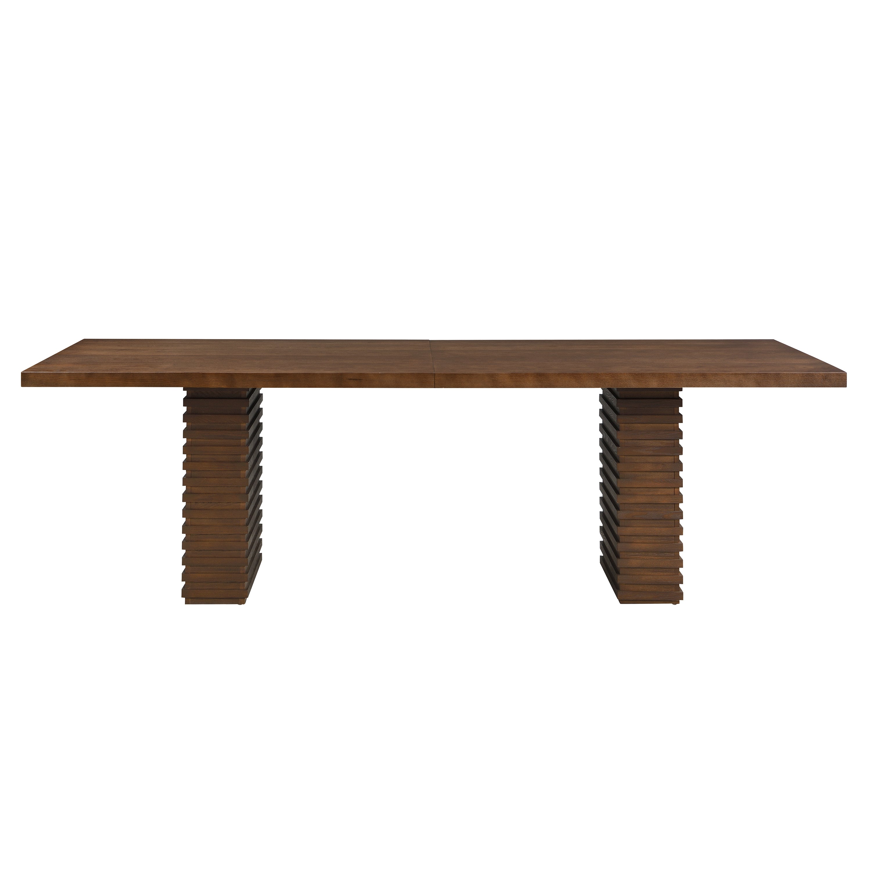 Front elevation of the walnut dining table on twin stacked-slat pedestal bases, plain white background
