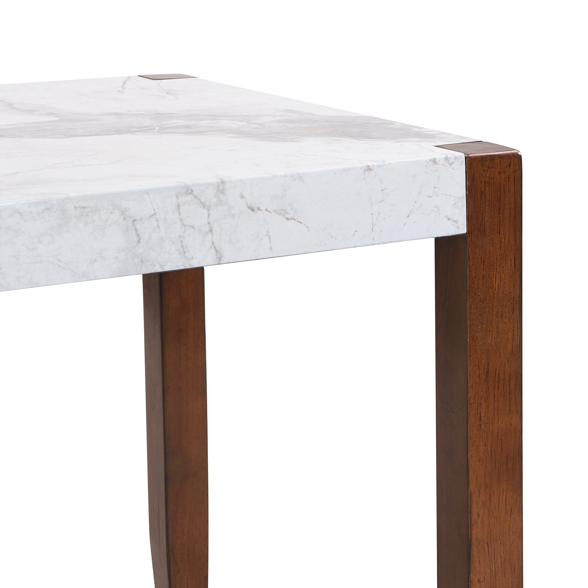 Close-up of a tabletop corner and brown wood leg on the faux marble dining table, white background