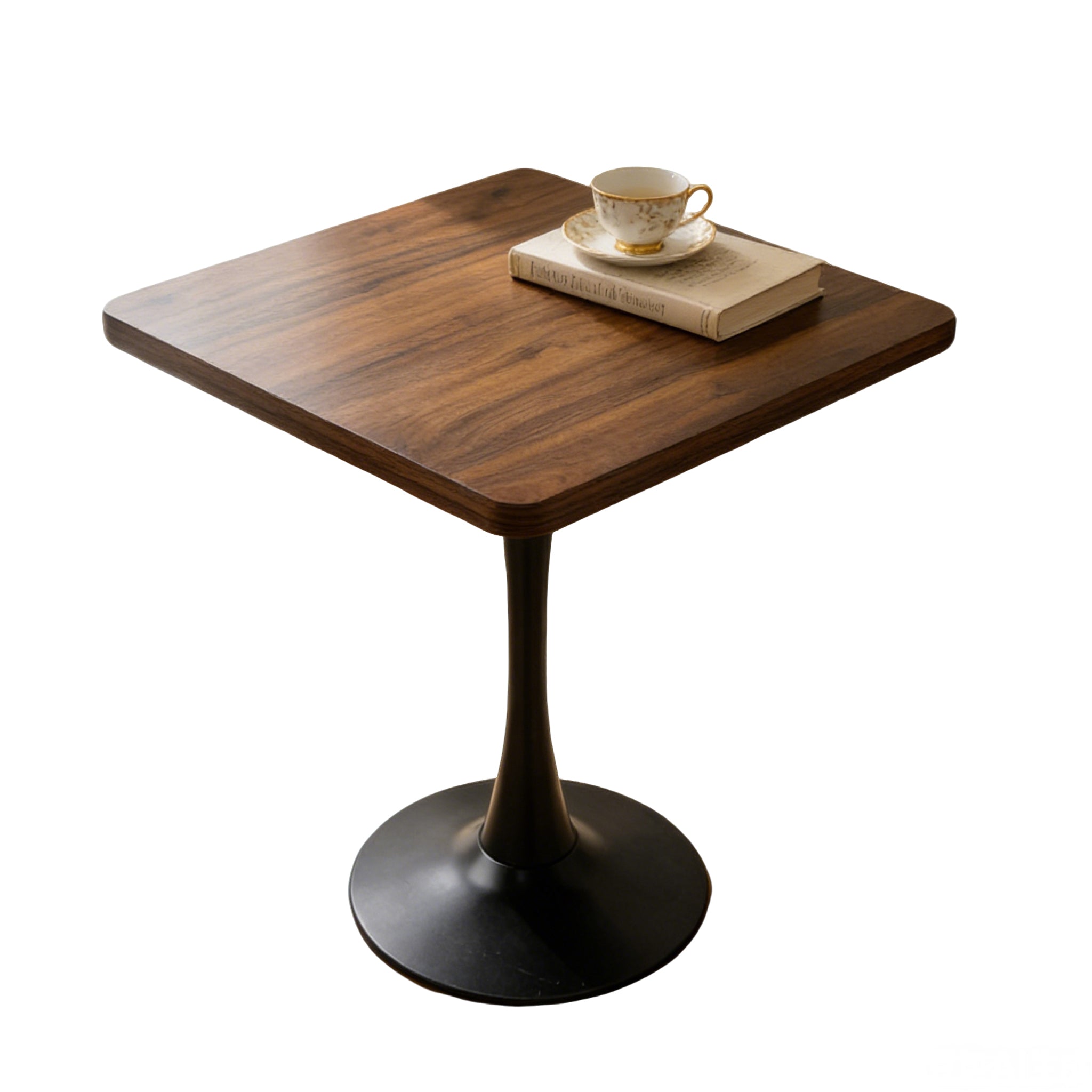 Three-quarter studio photo of the walnut square tulip table with a teacup on a book, plain white background