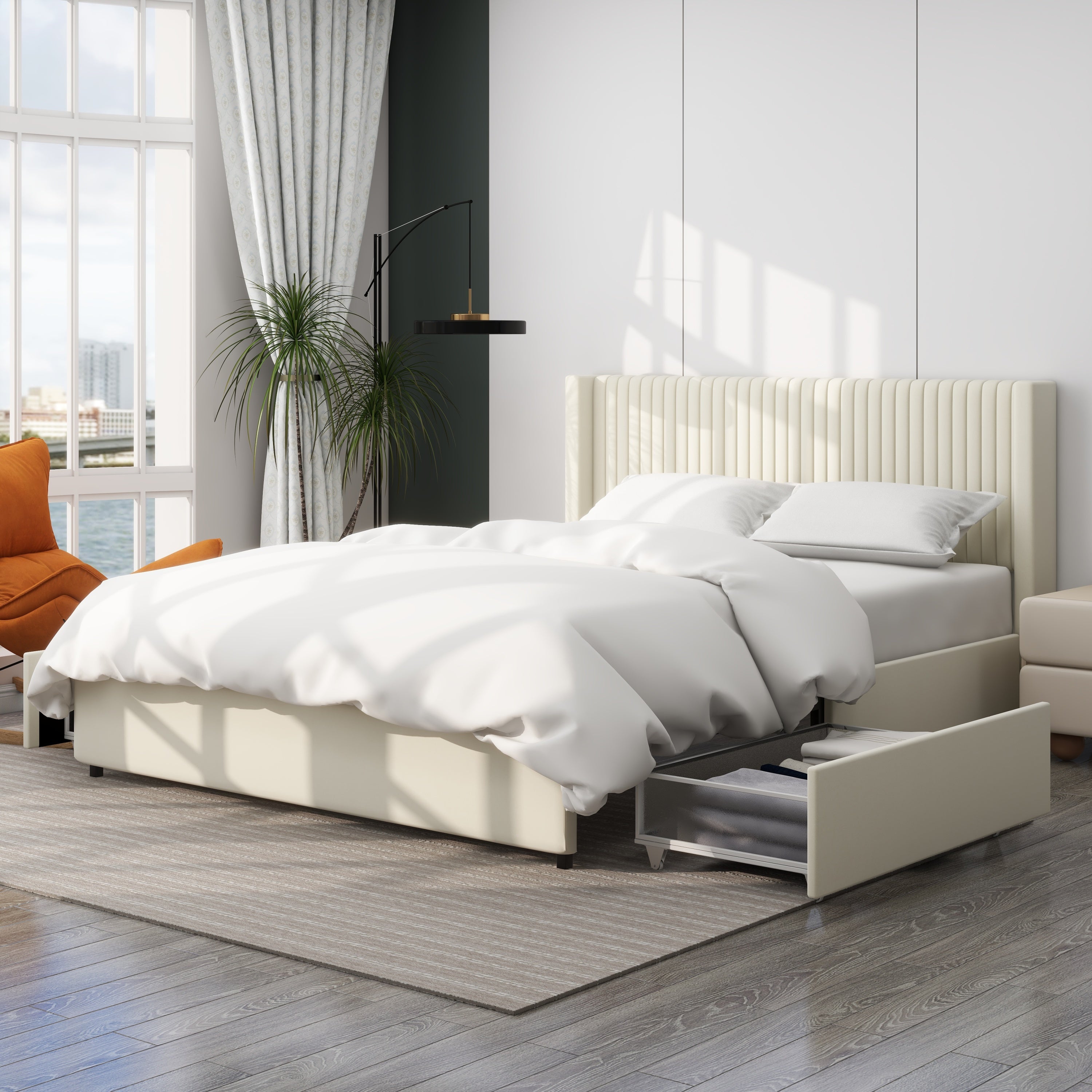 Angled ivory velvet storage bed in a bright bedroom with one side drawer open holding folded clothes