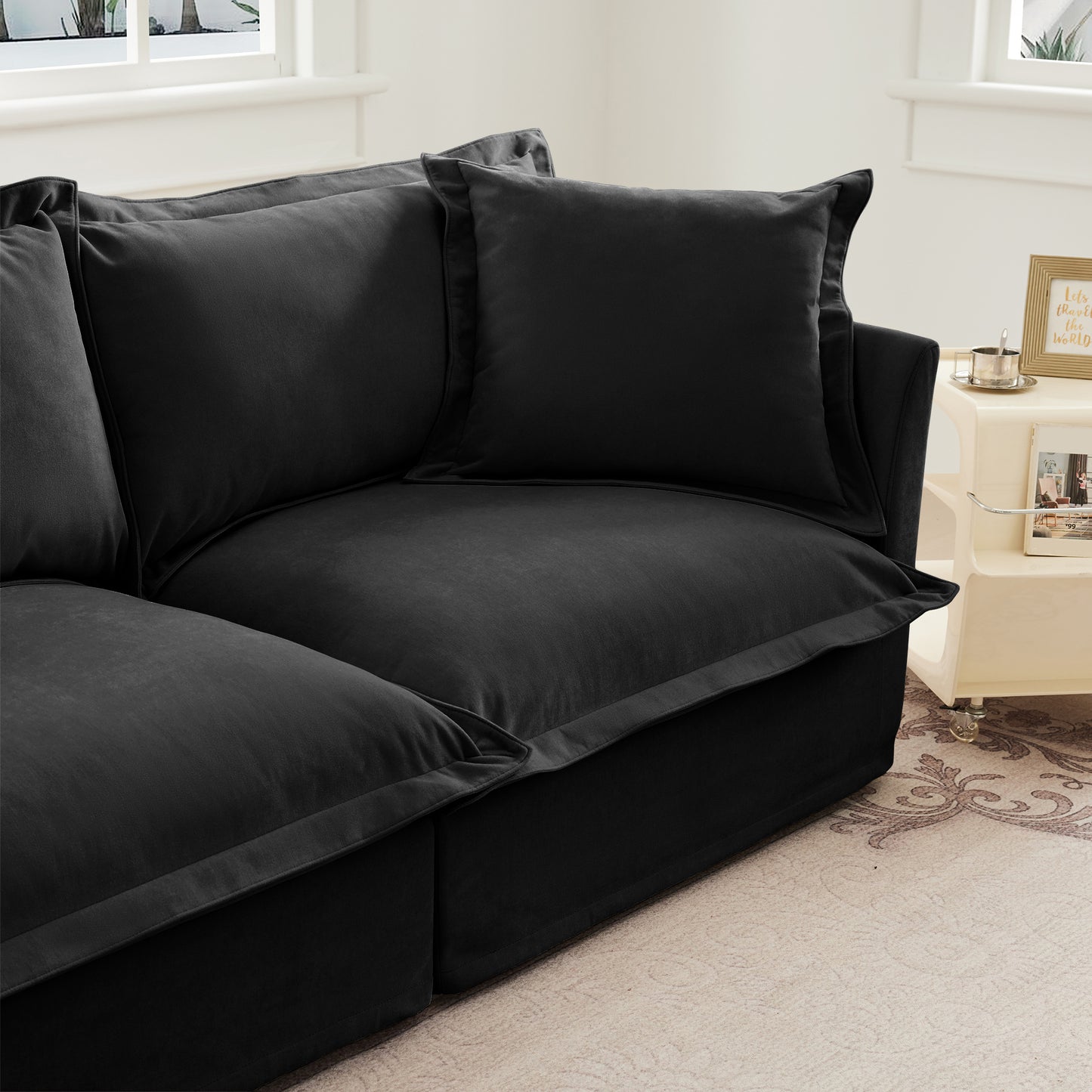 Close-up showcasing the fluffy black chenille sectional’s pillow, cushion, and armrest — emphasizing the plush padding, soft texture, and removable slipcovers for effortless upkeep and cozy lounging.