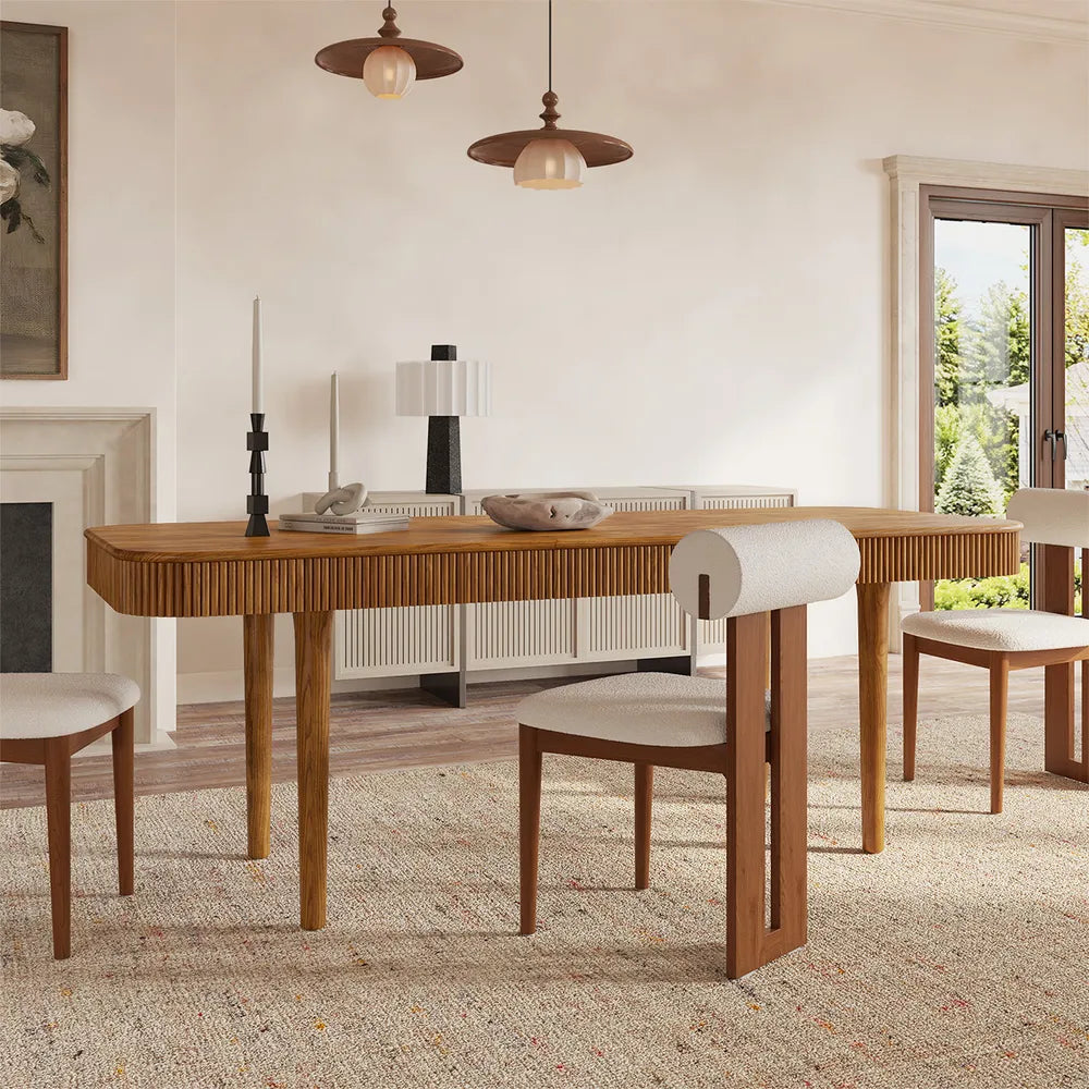 Lifestyle shot of extendable ash wood dining table with fluted detailing and warm brown finish, styled in a contemporary dining room.