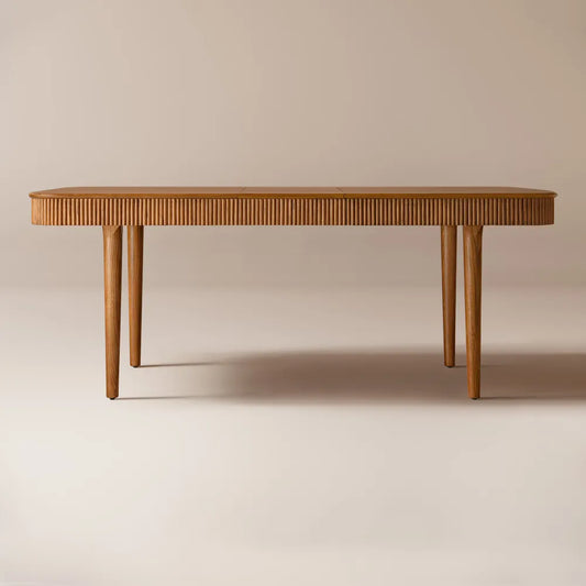 Modern rectangular dining table made of solid ash wood with fluted detailing and warm brown finish. Extends from 63 to 78 inches to seat 4–6 guests. A space-saving, mid-century inspired design perfect for everyday dining and larger gatherings.